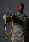 Tech. Sgt. Matthew Knight, 5th Force Support Squadron NCO in charge of career development, holds his spurs and acorns in the studio at Minot Air Force Base, N.D., Sept. 6, 2016. Knight was deployed with the U.S. Army’s 1st Infantry Division in 2009, where he completed the traditional Spur Ride to become a Cavalryman. (U.S. Air Force photo/Senior Airman Apryl Hall)