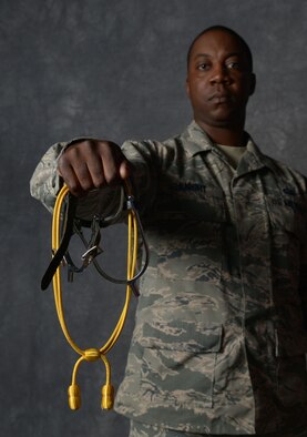 Tech. Sgt. Matthew Knight, 5th Force Support Squadron NCO in charge of career development, holds his spurs and acorns in the studio at Minot Air Force Base, N.D., Sept. 6, 2016. Knight was deployed with the U.S. Army’s 1st Infantry Division in 2009, where he completed the traditional Spur Ride to become a Cavalryman. (U.S. Air Force photo/Senior Airman Apryl Hall)