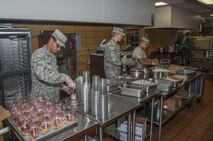5th Force Support Squadron Airmen prepare food for lunch at the Dakota Inn Dining Facility at Minot Air Force Base, N.D., Sept. 7, 2016. The new DFAC is now open to the entire base population. (U.S. Air Force photo/Airman 1st Class Christian Sullivan) 