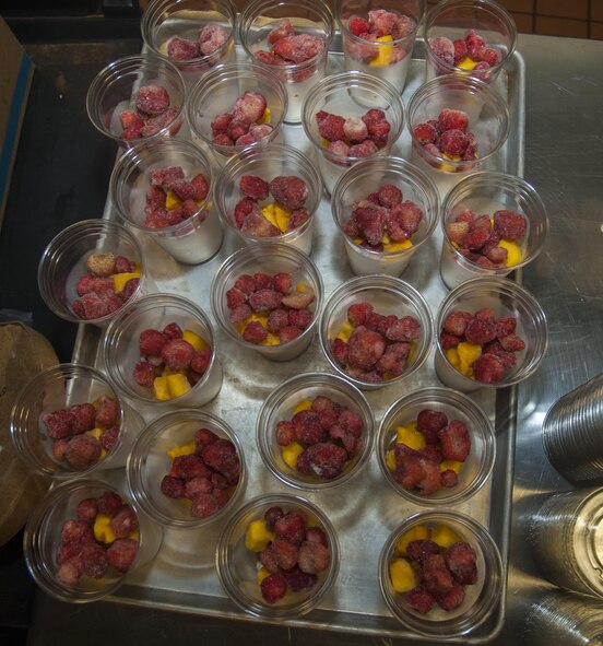 Cups of fruit are prepared for smoothies before the lunch rush hits the Dakota Inn Dining Facility at Minot Air Force Base, N.D., Sept. 7, 2016. A smoothie bar is one of the many new healthy options the upgraded DFAC has to offer. (U.S. Air Force photo/Airman 1st Class Christian Sullivan)