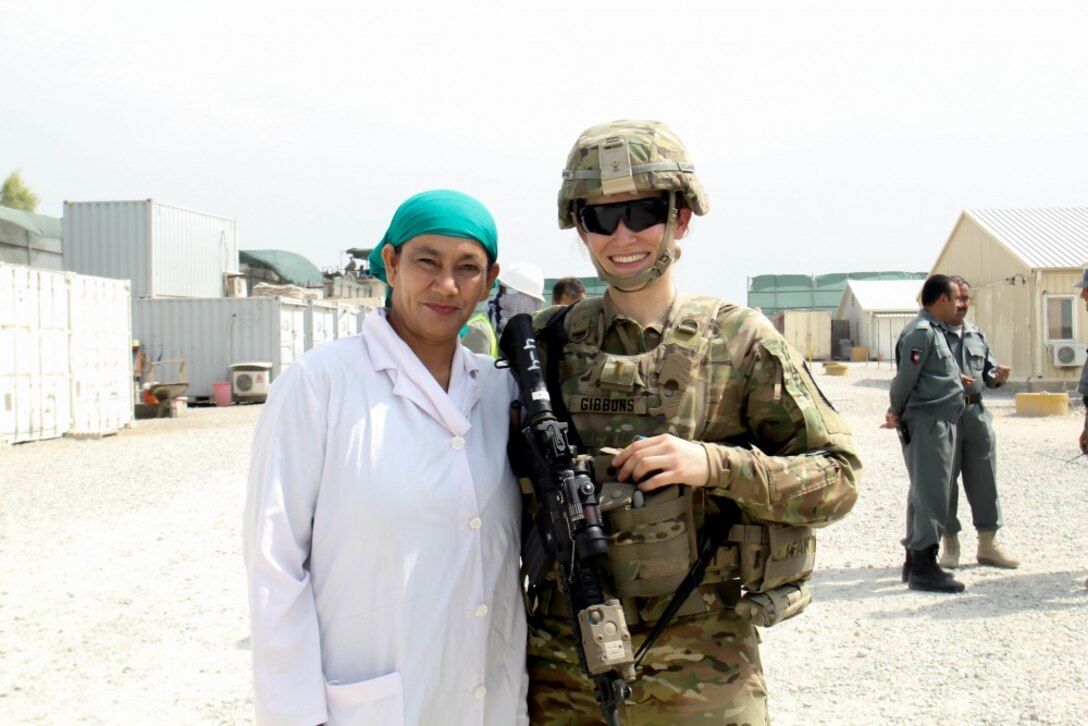 Army 2nd Lt. Eva Gibbons, assigned to the 3rd Cavalry Regiment, stands with Yassmin, her Afghan counterpart, during an advising engagement at the 202nd Police Zone Regional Training Center in Nangarhar province, Afghanistan, July 14, 2016. Yassmin is a doctor, and is currently the only female working at the RTC. Army photo by Capt. Grace Geiger