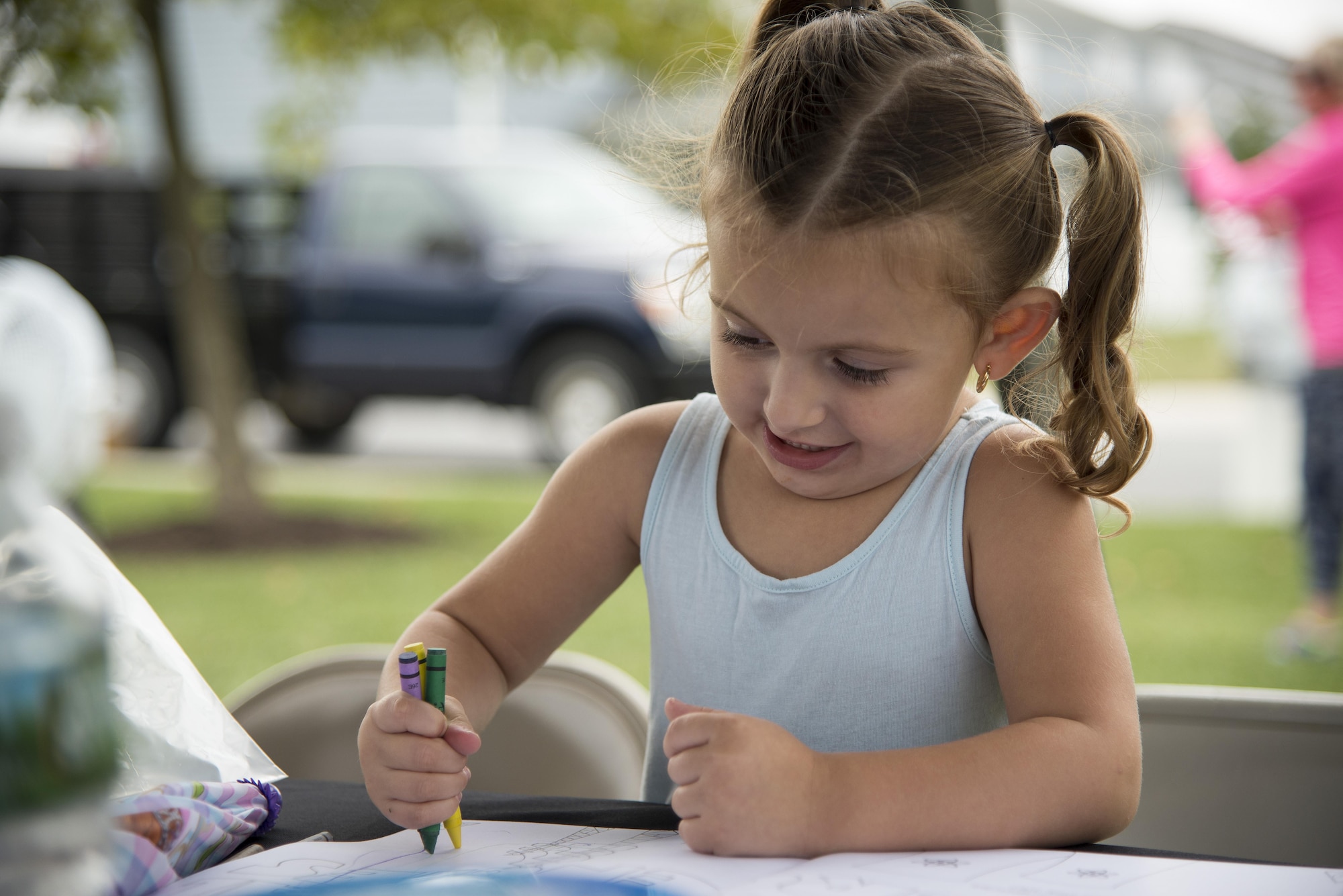 Anastasia Ienci, 2, daughter of Staff Sgt. Paul Ienci, 436th Aerial Port Squadron special handling supervisor, colors during the Emergency Management Block Party on Sept. 1, 2016, in base housing on Dover Air Force Base, Del. The event, which was intended to remind Team Dover families about emergency preparedness, hosted activities for participants of all ages. (U.S. Air Force photo by Senior Airman Aaron J. Jenne)