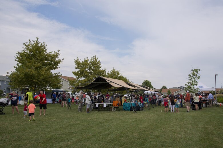 Members of Team Dover participate in the annual Emergency Management Block Party on Sept. 1, 2016, in base housing on Dover Air Force Base, Del. Each year, on-base Emergency Management agencies and off-base vendors come together during the Labor Day weekend to remind members of Team Dover to plan ahead and be prepared before they find themselves in an emergency situation. (U.S. Air Force photo by Senior Airman Aaron J. Jenne)