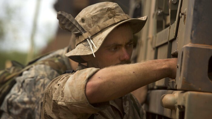 U.S. Marine Lance Cpl. John Taylor reaches for tools during Exercise Kowari at Daly River region, Northern Territory, Australia, Sept. 4, 2016. The purpose of Exercise Kowari is to enhance the United States, Australia, and China’s friendship and trust, through trilateral cooperation in the Indo-Asia-Pacific region.