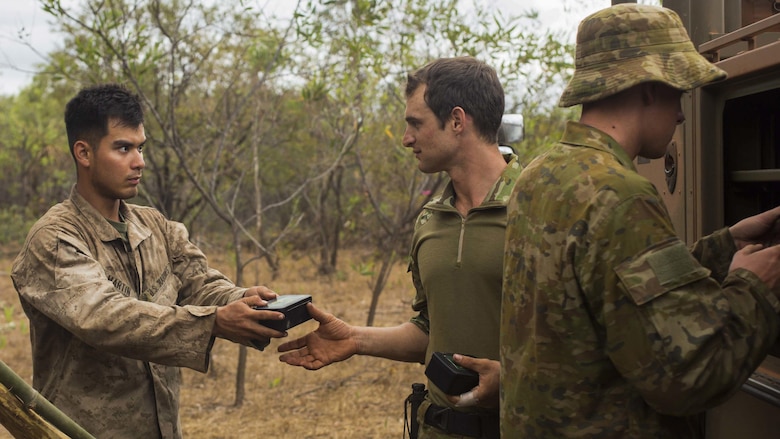 U.S. Marine Lance Cpl. Maxwell Martin and an Australian Army soldier turn in survival kits before the final training phase of Exercise Kowari at Daly River region, Northern Territory, Australia, Sept. 4, 2016. The purpose of Exercise Kowari is to enhance the United States, Australia, and China’s friendship and trust, through trilateral cooperation in the Indo-Asia-Pacific region.