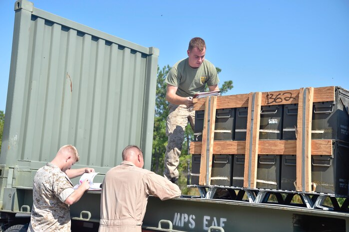 Marines from U.S. Marine Corps Base Quantico, Virginia, Detachment Charleston, inspect a pallet of munitions prior to storing it in a magazine, Sept 7, 2016, at Joint Base Charleston - Weapons Station, South Carolina. Before arriving at the JB Charleston-WS, the Sacagawea was prepositioned with more than 2,000 pallets of ordnance. The ship’s mission is to sustain a Marine Corps expeditionary brigade for up to 30 days, enabling a quick response when needed. (U.S. Air Force Photo/Airman Megan Munoz)