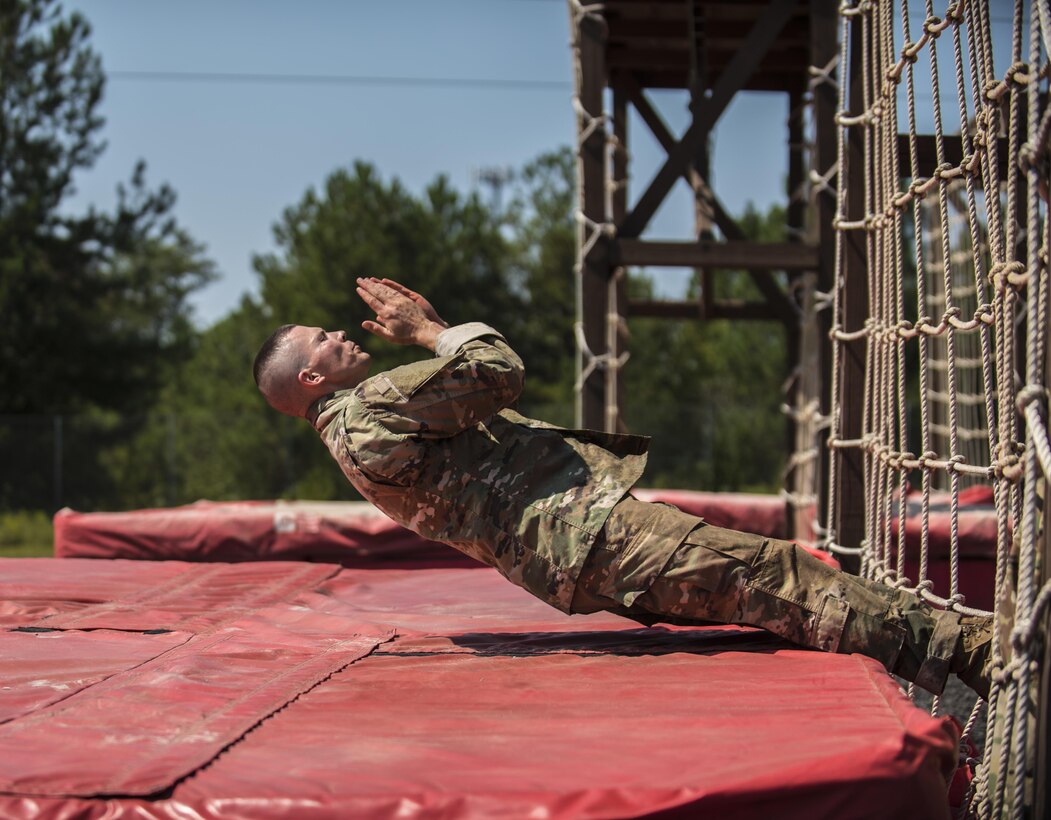 Army Reserve Drill Sergeant of the Year competitor, Sgt. 1st Class Jason Scott, 95th Training Division (IET), completes the cargo net obstacle on the fit to win obstacle course during the 2016 TRADOC Drill Sergeant of the Year competition, Sept. 8.  Scott and Sgt. Ryan Moldovan, 98th Training Division (IET), are facing off in a head to head competition at Fort Jackson, S.C., to see who will be named the 2016 Army Reserve Drill Sergeant of the Year.(U.S. Army Reserve photo by Sgt. 1st Class Brian Hamilton/ released)