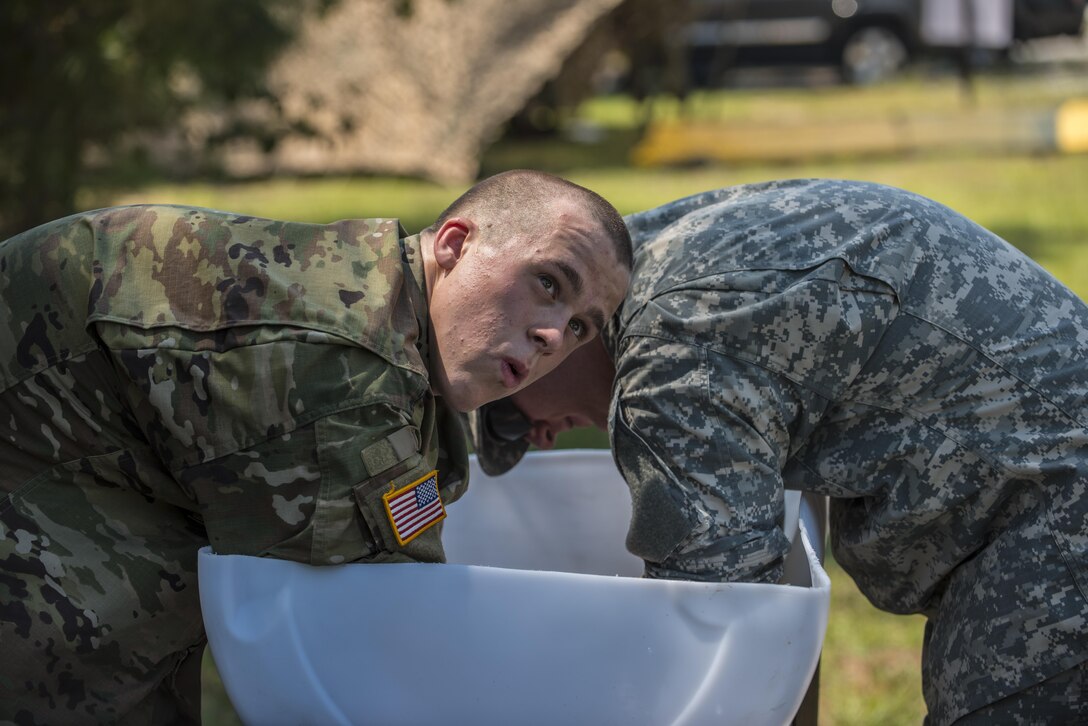 Soldiers in Basic Combat Training assisting with the 2016 Drill Sergeant and AIT Platoon Sergeant of the Year competition held Sept. 6-9 at Fort Jackson, S.C., take an opportunity to cool off in the arms immersion cooler during the competition. (U/S. Army Reserve photo by Sgt. 1st Class Brian Hamilton)