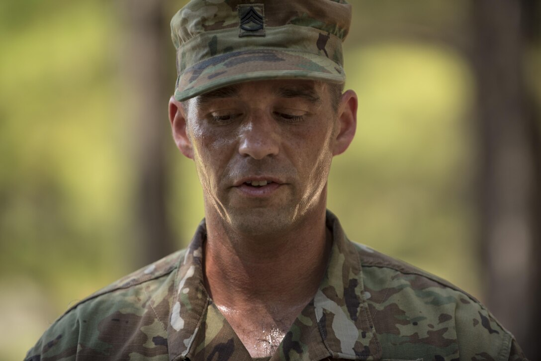 A competitor at the 2016 TRADOC Drill Sergeant and AIT Platoon Sergeant of the Year competion struggles to catch his breath before pitching a drill and ceremony module to trainees in Basic Combat Training, Sept. 8, at Fort Jackson, S.C. The Soldier had just completed the timed fit to win obstacle course. The competition runs Sept 6-9. (U.S. Army photo by Sgt. 1st Class Brian Hamilton/ released)