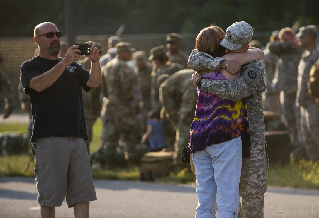 Approximately 90 U.S. Army Reserve military police Soldiers from the 443rd Military Police Company, of Owings Mills, Maryland, return home to embrace family and loved ones after a 10-month deployment to Guantanamo Bay, Cuba, Sept. 9. (U.S. Army Reserve photo by Master Sgt. Michel Sauret)