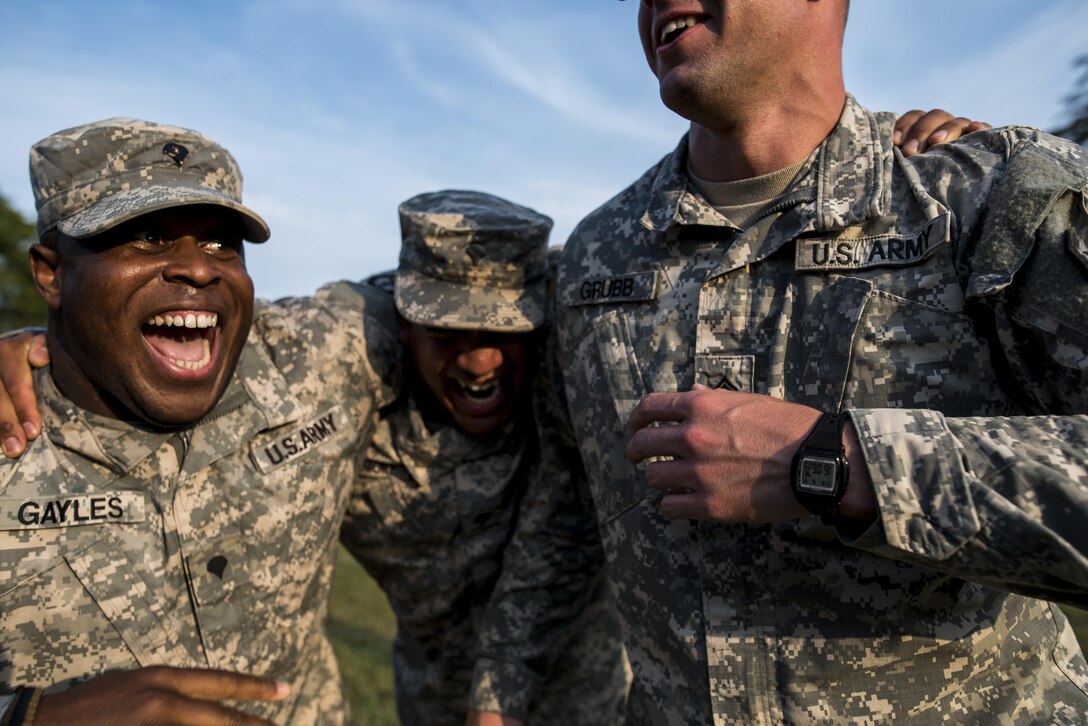Spc. Jerard Gayles, Spc. Deon Lissimore and Sgt. Aaron Grubb, U.S. Army Reserve military police Soldiers from the 443rd Military Police Company, of Owings Mills, Maryland, goof around after returning home from a 10-month deployment to Guantanamo Bay, Cuba, Sept. 9. (U.S. Army Reserve photo by Master Sgt. Michel Sauret)