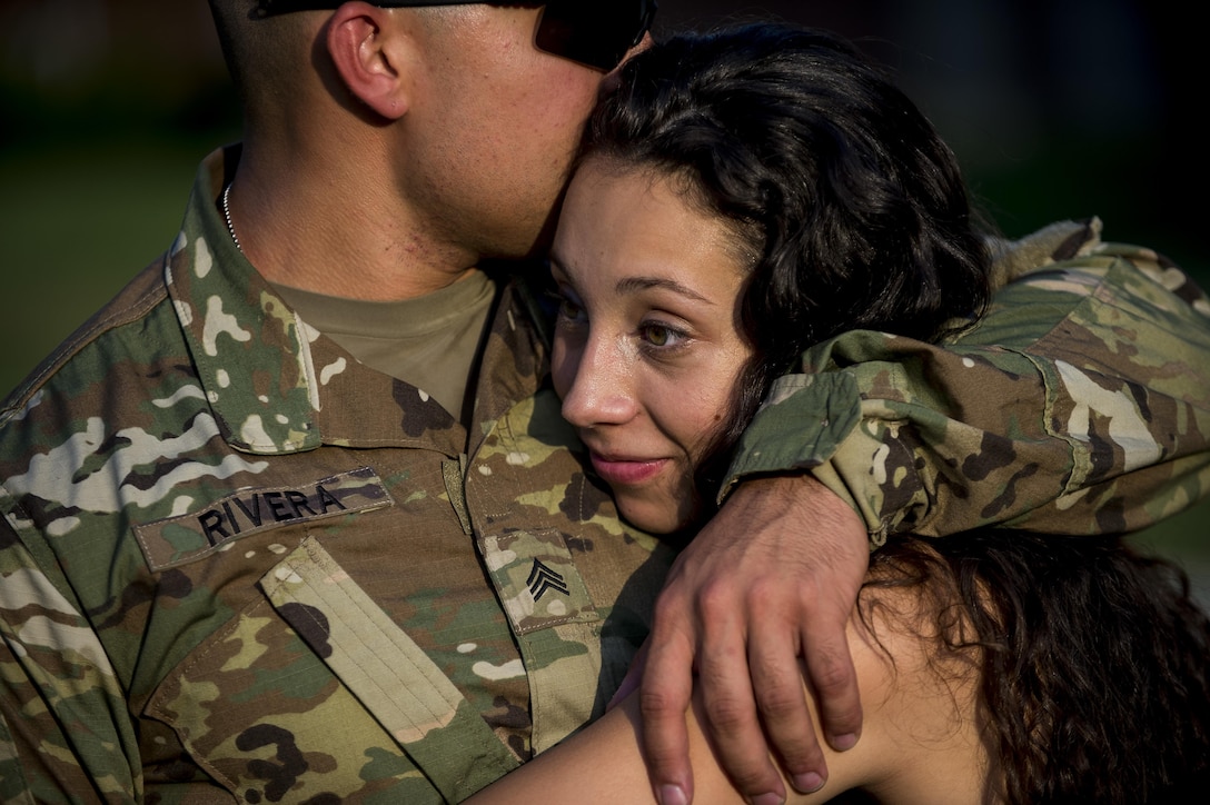 Sgt. Daniel Rivera, a U.S. Army Reserve military police Soldier from the 443rd Military Police Company, of Owings Mills, Maryland, embraces his girlfriend, Jennifer Wade, after returning home from a 10-month deployment to Guantanamo Bay, Cuba, Sept. 9. (U.S. Army Reserve photo by Master Sgt. Michel Sauret)