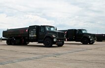 Two fuel trucks rest in the parking lot after getting refueled at the 5th Logistics Readiness Squadron’s POL shop at Minot Air Force Base, N.D., Aug. 31, 2016. The four different refueling vehicles used by the 5th LRS are the R-12 Hydrant Servicing Vehicle, R-11 Refueler, C300 and C301. (U.S. Air Force photo/Airman 1st Class Jonathan McElderry)