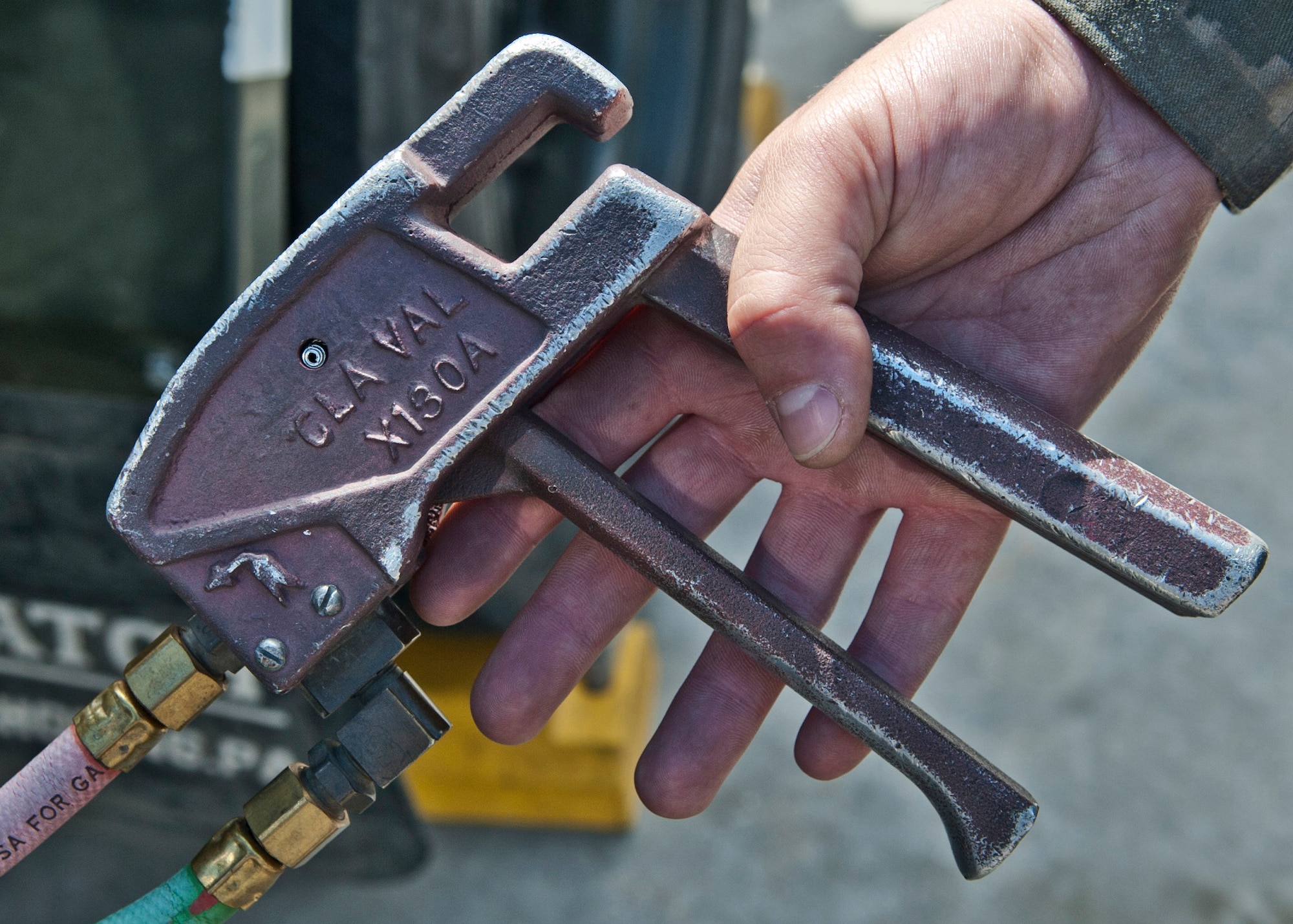 Senior Airman Samuel Fallot, a fuels operator with the 5th Logistics Readiness Squadron, controls a dead man switch on the flightline at Minot Air Force Base, N.D., Sept. 6, 2016. The dead man switch uses air to pressurize the fuel system from the ground, fuel truck and aircraft. (U.S. Air Force photo/Airman 1st Class Jonathan McElderry)