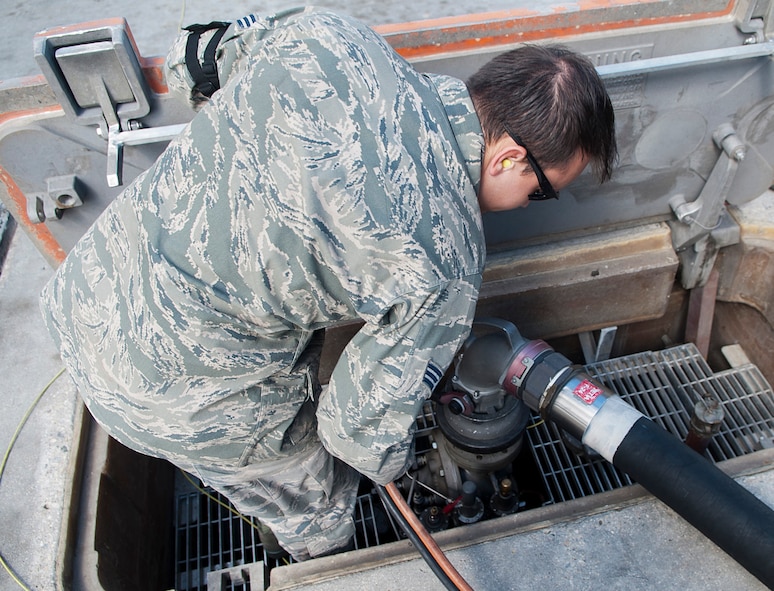 Senior Airman Samuel Fallot, a fuels operator with the 5th Logistics Readiness Squadron, removes a hose from a fuel pump on the flightline at Minot Air Force Base, N.D., Sept. 6, 2016. Using this fuel system, the fuel is pumped in a continuous loop in order for it to be successfully removed from the ground. (U.S. Air Force photo/Airman 1st Class Jonathan McElderry)