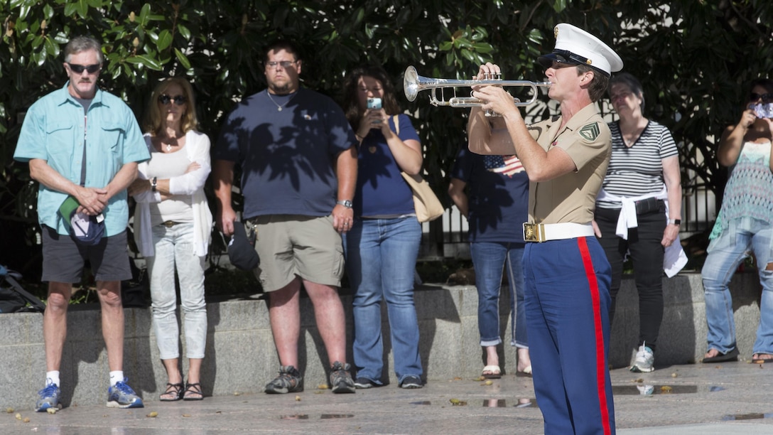 A member of the U.S. Marine Corps Band plays Taps during a 9/11 Remembrance Ceremony in Nashville, Tenn., Sept. 11, 2016. Marine Week Nashville is a chance to reconnect with our Marines, sailors, veterans and their families from different generations.