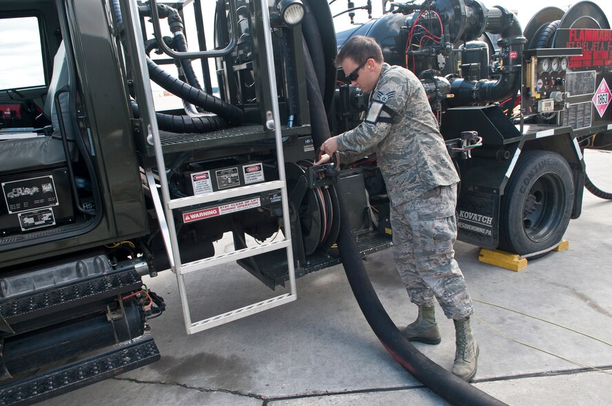 Senior Airman Samuel Fallot, a fuels operator with the 5th Logistics Readiness Squadron, puts away a hose on a refueling truck after refueling a B-52H Stratofortress at Minot Air Force Base, N.D., Sept. 6, 2016. Depending on their flight schedule, up to eight B-52H Stratofortresses are refueled daily. (U.S. Air Force photo/Airman 1st Class Jonathan McElderry)
