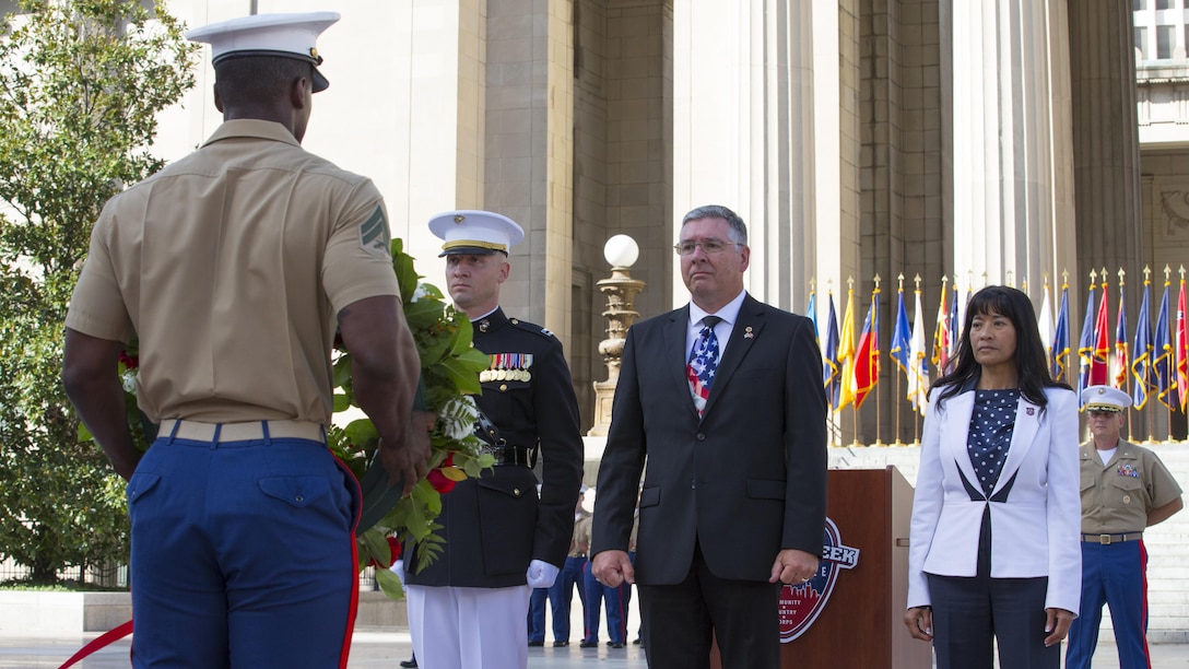A Marine with Special Purpose Marine Air Ground Task Force – Nashville carries a wreath dedicated to Lance Cpl. Brian Montgomery, who was killed while in Haditha, Iraq in 2005, to Montgomery’s father and brother during a 9/11 Remembrance Ceremony in Nashville, Tenn., Sept. 11, 2016. Marine Week Nashville is an opportunity to commemorate the unwavering support of the American people, and show the Marine Corps' continued dedication to protecting the citizens of this country.