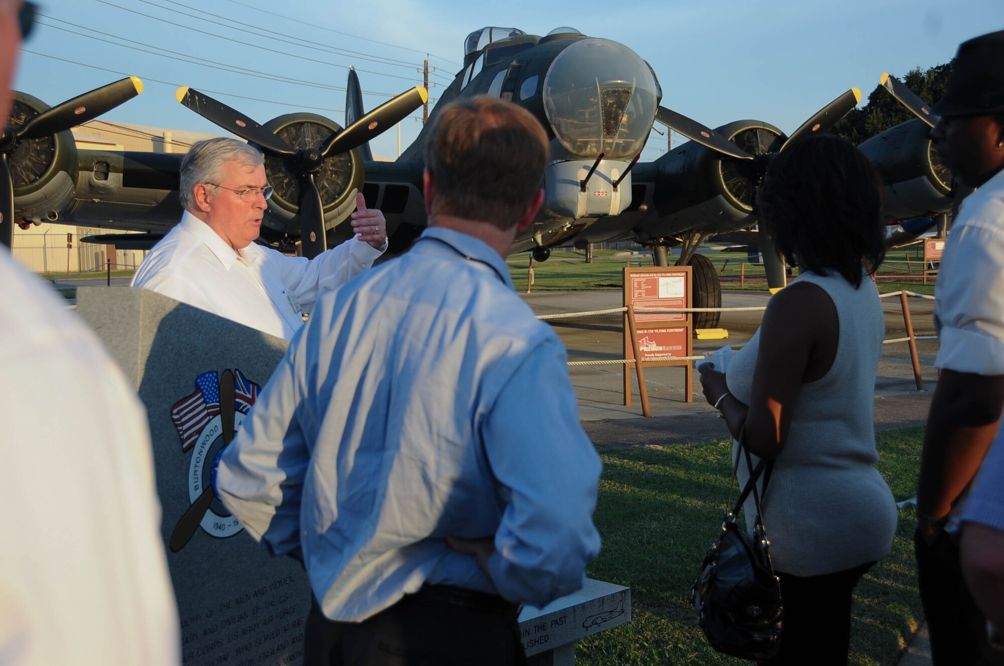 Lane Callaway, left, Eighth Air Force historian, stands in front of the B-17 static display, named Yankee Doodle II, and tells civic leaders about Army Air Forces Sgt. Maynard Smith, the first enlisted recipient of the Medal of Honor in Eighth Air Force as well as the Army Air Forces. Approximately 90 local community members attended an event at the Barksdale Global Airpower Museum Sept. 8. (U.S. Air Force photo by A1C Stuart Bright)