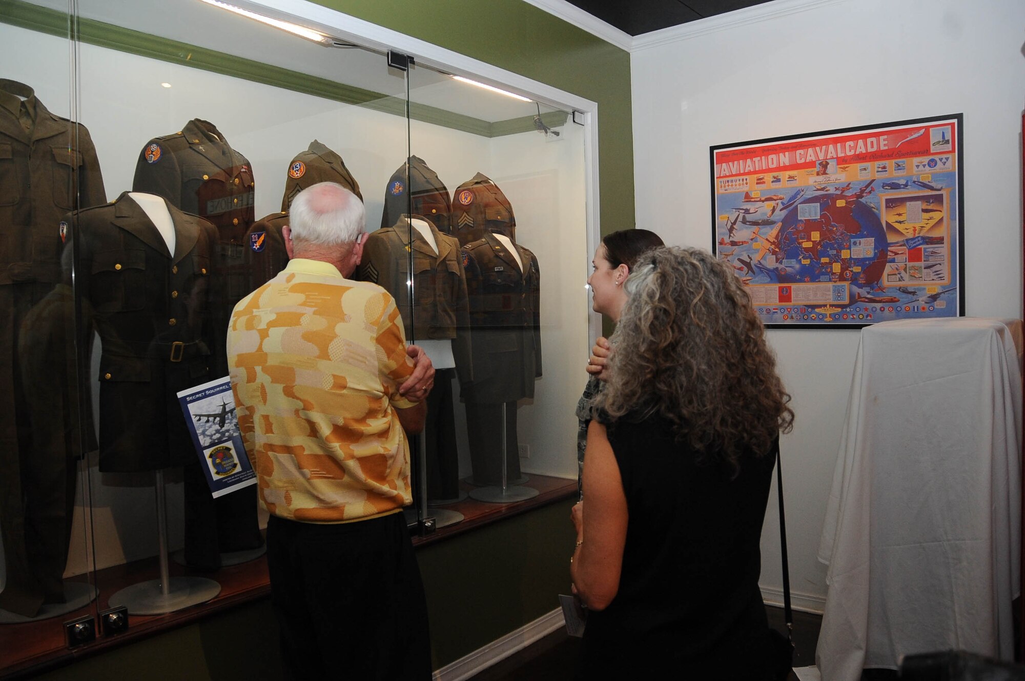 Civic leaders inspect the various eras of uniforms during an Eighth Air Force civic outreach event at the Global Airpower Museum on Barksdale Air Force Base, La., Sept. 8. Approximately 90 guests attended the event, which offered an array of historical memorabilia and presentations by Airmen. (U.S. Air Force photo by A1C Stuart Bright)