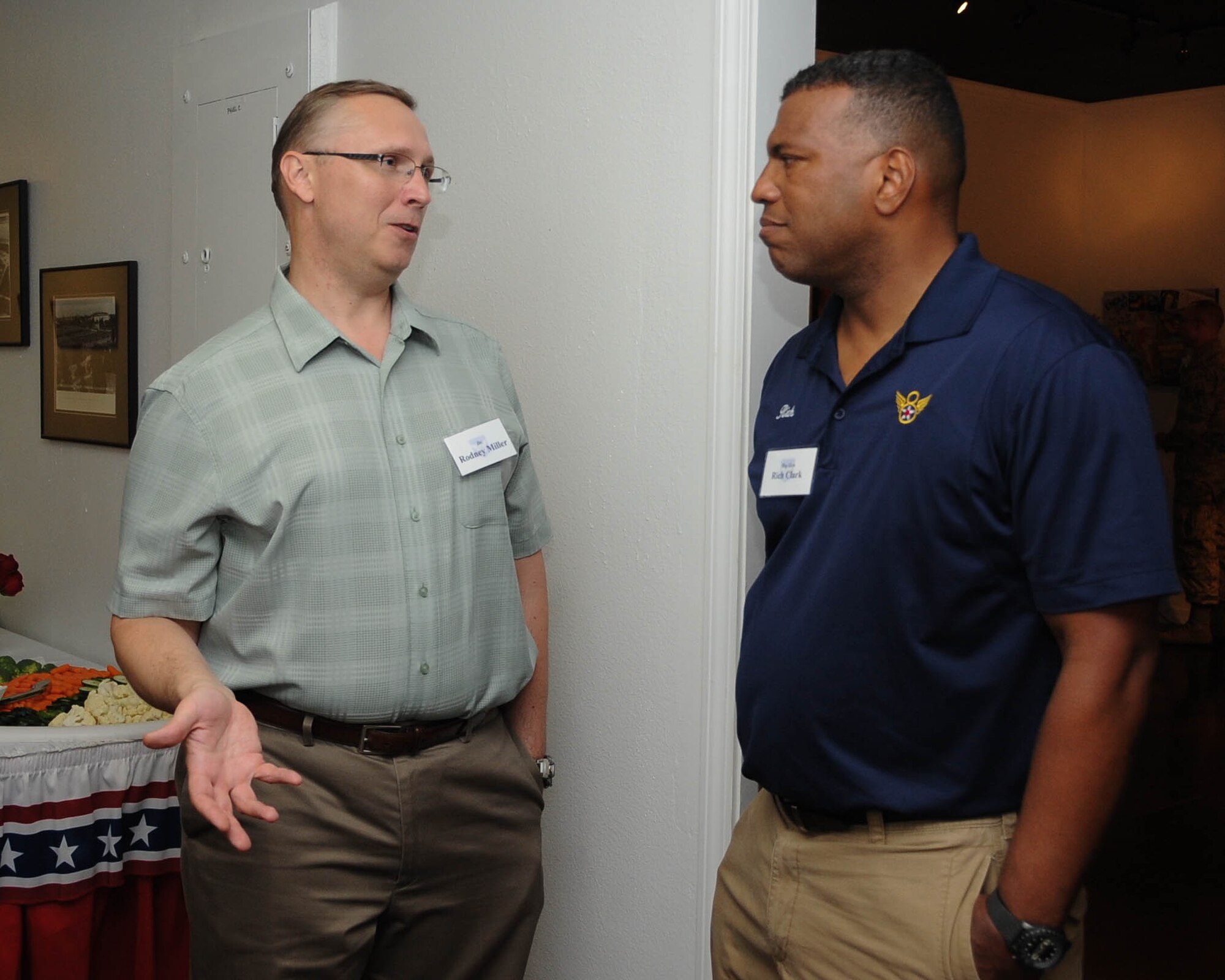 U.S. Air Force Maj. Gen. Richard M. Clark, right, Eighth Air Force commander, and Rodney Miller, Air Force Global Strike Command's chief scientist, talk about the various exhibits at the Eighth Air Force's civic leader event held at the Global Airpower Museum, Sept. 8. Approximately 90 guests from the local community attended the event. (U.S. Air Force photo by A1C Stuart Bright)