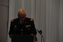 Chaplain (Major) Mark East, 1st MSC Deputy Command Chaplain, gives his prayer for all the members of the Armed Forces.