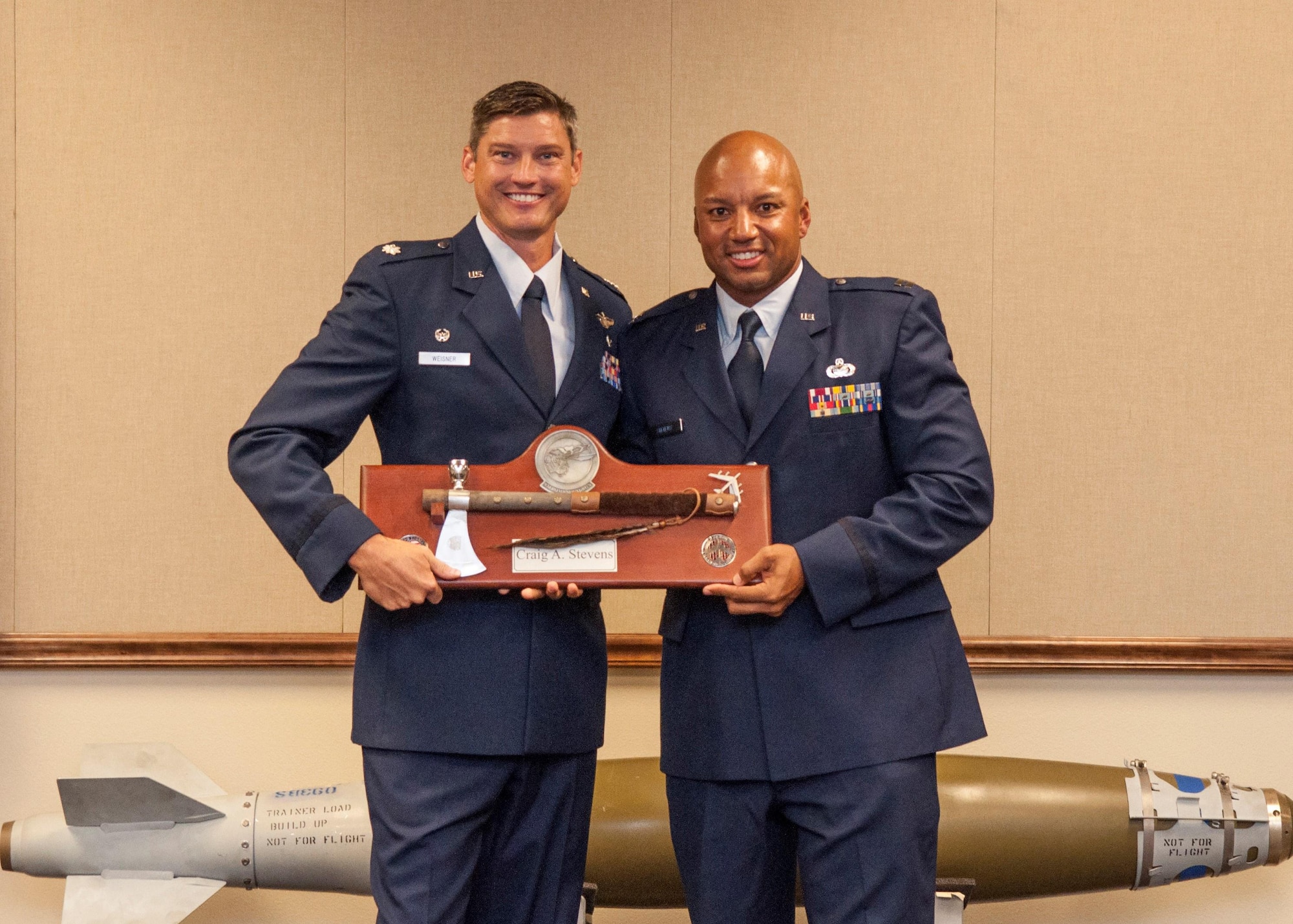 U.S. Air Force Lt. Col. Brent Weisner, 93rd Bomb Squadron (BS) commander, presents Capt. Craig Stevens with a tomahawk during Stevens’ retirement ceremony on Sept. 10, 2016, at Barksdale Air Force Base, La.  Stevens is the executive officer for the 93rd BS and is retiring after serving more than 25 years in the military. (U.S. Air Force photo by Tech. Sgt. Cody Burt/Released)