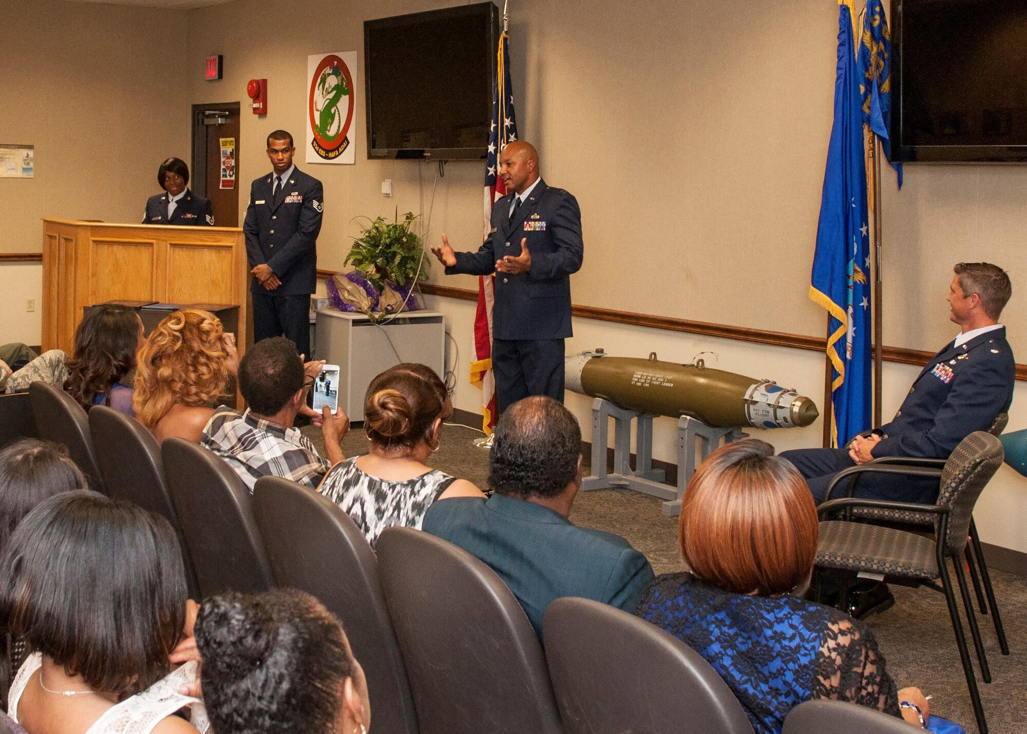 U.S. Air Force Capt. Craig Stevens addresses his family and friends at his retirement ceremony on Sept. 10, 2016.  Stevens is the executive officer for the 93rd Bomb Squadron at Barksdale Air Force Base, La., and is retiring after serving more than 25 years in the military. (U.S. Air Force photo by Tech. Sgt. Cody Burt/Released)