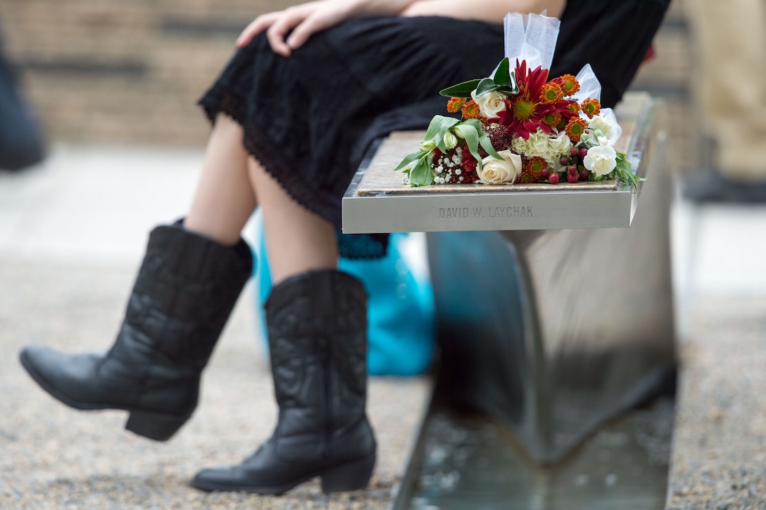 A bouquet adorns on a bench at the National 9/11 Pentagon Memorial, Sept. 11, 2016. Family members who lost loved ones on 9/11 attended a ceremony at the memorial marking the 15th anniversary the attacks. DoD photo by Navy Petty Officer 2nd Class Dominique A. Pineiro