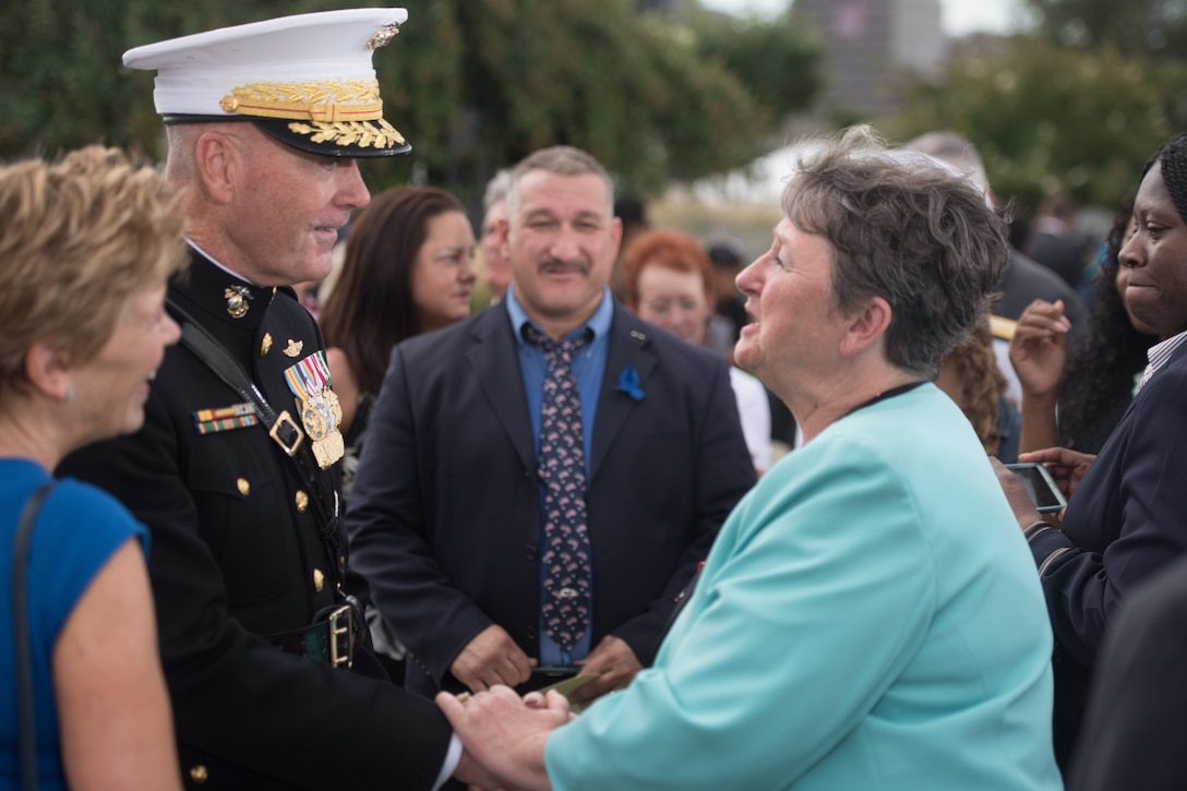 Marine Corps Gen. Joe Dunford, chairman of the Joint Chiefs of Staff, talks with an attendee during a remembrance ceremony at the National 9/11 Pentagon Memorial, Sept. 11, 2016. DoD photo by Navy Petty Officer 2nd Class Dominique A. Pineiro