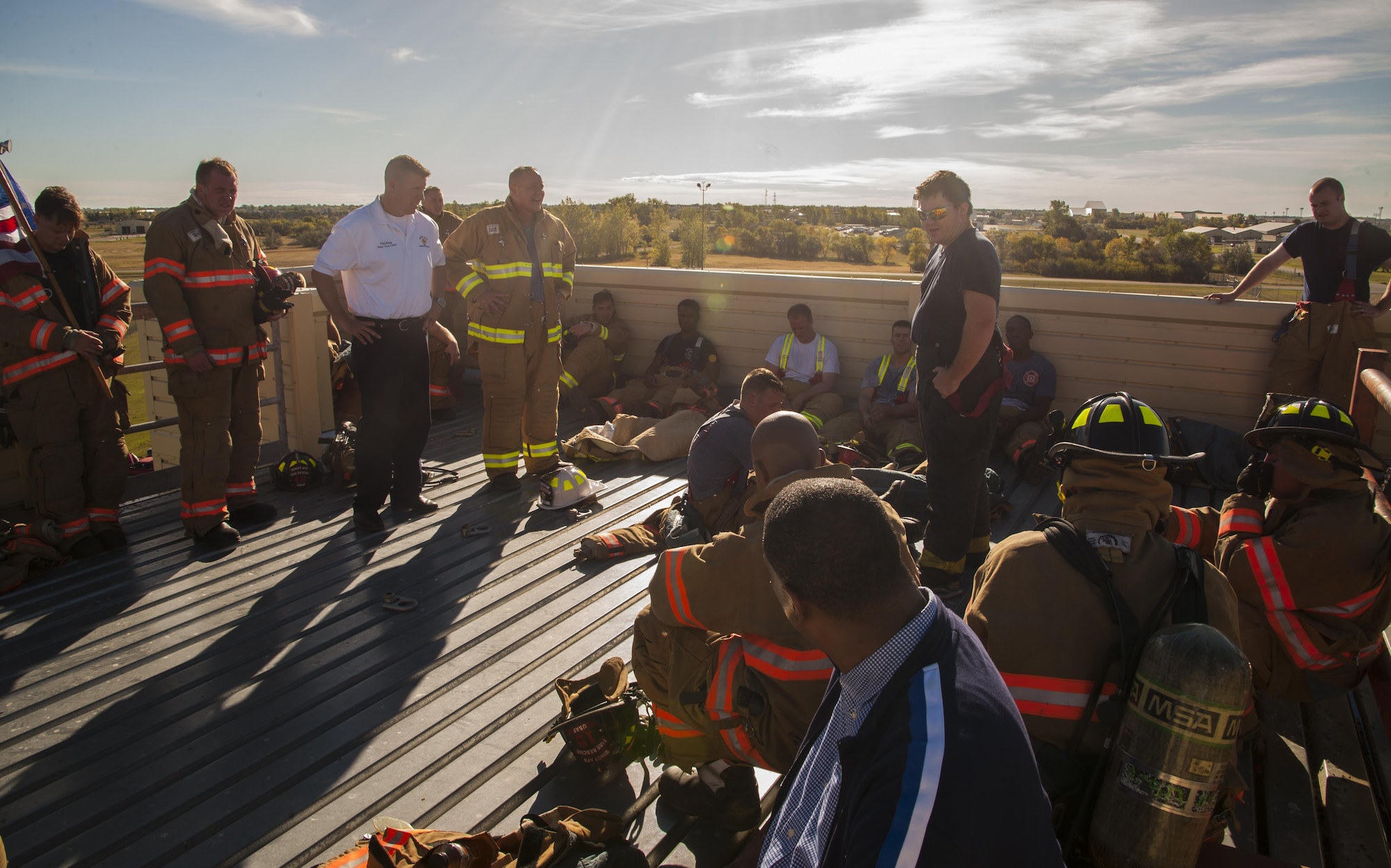 Minot Air Force Base firefighters catch their breath after climbing 110 flights of stairs in honor of 9/11 at Minot AFB, N.D., Sept. 11, 2016. The fire department climbed not only in honor of the innocent lives of the people that were in the towers already, but the 343 firefighters who lost their lives as well. (U.S. Air Force photo/Airman 1st Class Christian Sullivan)