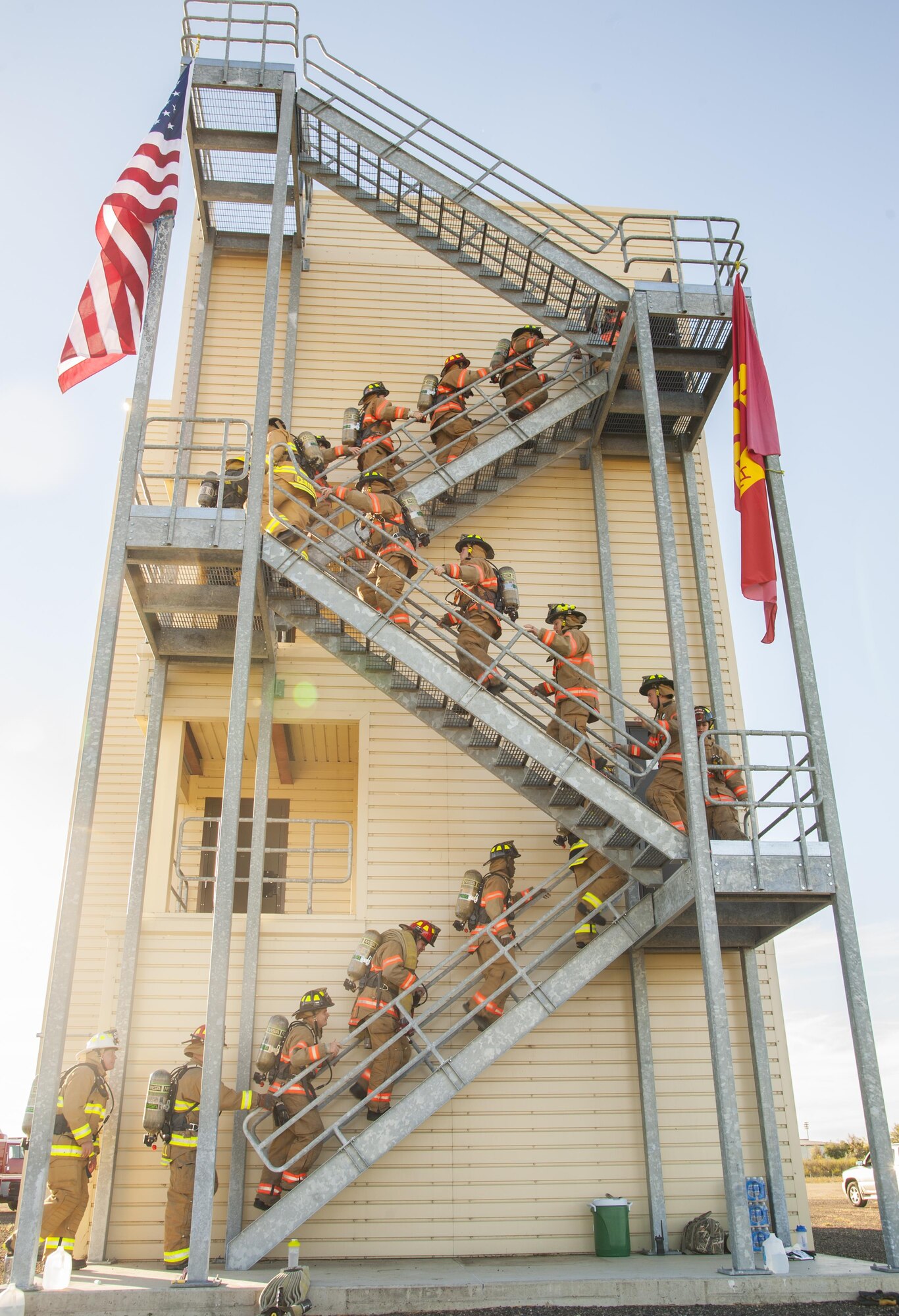 Firemen from the 5th Civil Engineer Squadron climb stairs during their 9/11 memorial climb at Minot Air Force Base, N.D., Sept. 11, 2016. In honor of the emergency responders who lost their lives in the terrorist attacks of 9/11, the Minot AFB fire department climbed 110 stories, the equivalent of what the twin towers had prior to the attack. (U.S. Air Force photo/Airman 1st Class Christian Sullivan)