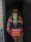 Tech. Sgt. Daniel Nembhard, 5th Civil Engineer Squadron firefighter, enters the training tower at the top of the stairs during the fire department’s 9/11 memorial climb at Minot Air Force Base, N.D., Sept. 11, 2016. The base fire department along with off-base emergency responders held the memorial in honor of those who gave the ultimate sacrifice responding to the 9/11 attacks. (U.S. Air Force photo/Airman 1st Class Christian Sullivan)
