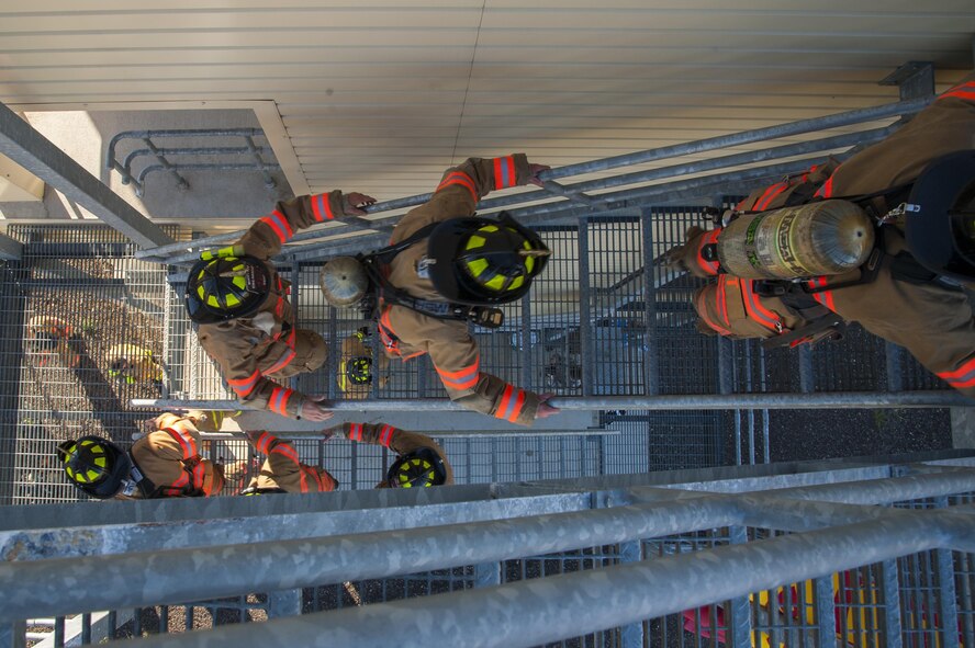 Minot Air Force Base firemen climb stairs in honor of the 15th Anniversary of 9/11 at Minot AFB, N.D., Sept. 11, 2016. The base fire department along with off-base emergency responders held the memorial in honor of those who gave the ultimate sacrifice responding to the 9/11 attacks. (U.S. Air Force photo/Airman 1st Class Christian Sullivan)