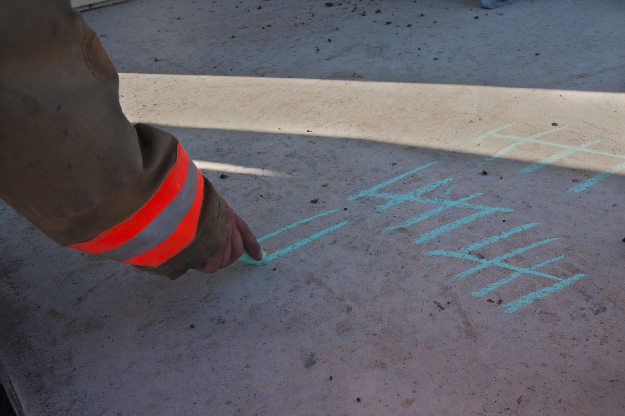 Senior Airman, Nickolas Torrez, 5th Civil Engineer Squadron firefighter, marks the number of flights he and other firefighters climbed during their 9/11 memorial climb at Minot Air Force Base, N.D., Sept. 11, 2016. The memorial not only paid tribute to the 343 firefighters who lost their lives, but also honored other first responders and innocent bystanders who were affected by the attack. (U.S. Air Force photo/Airman 1st Class Christian Sullivan)
