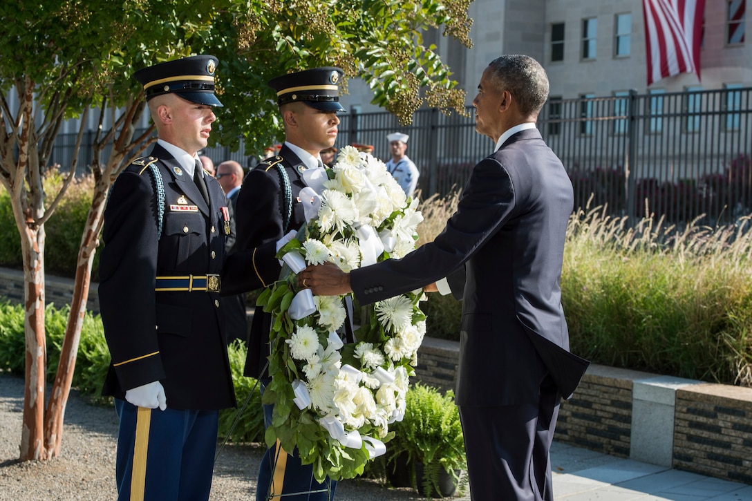 President Barack Obama places a wreath during a ceremony at the Pentagon marking the 15th anniversary of the 9/11 attacks, Sept. 11, 2016. DoD photo by Air Force Tech. Sgt. Brigitte N. Brantley
