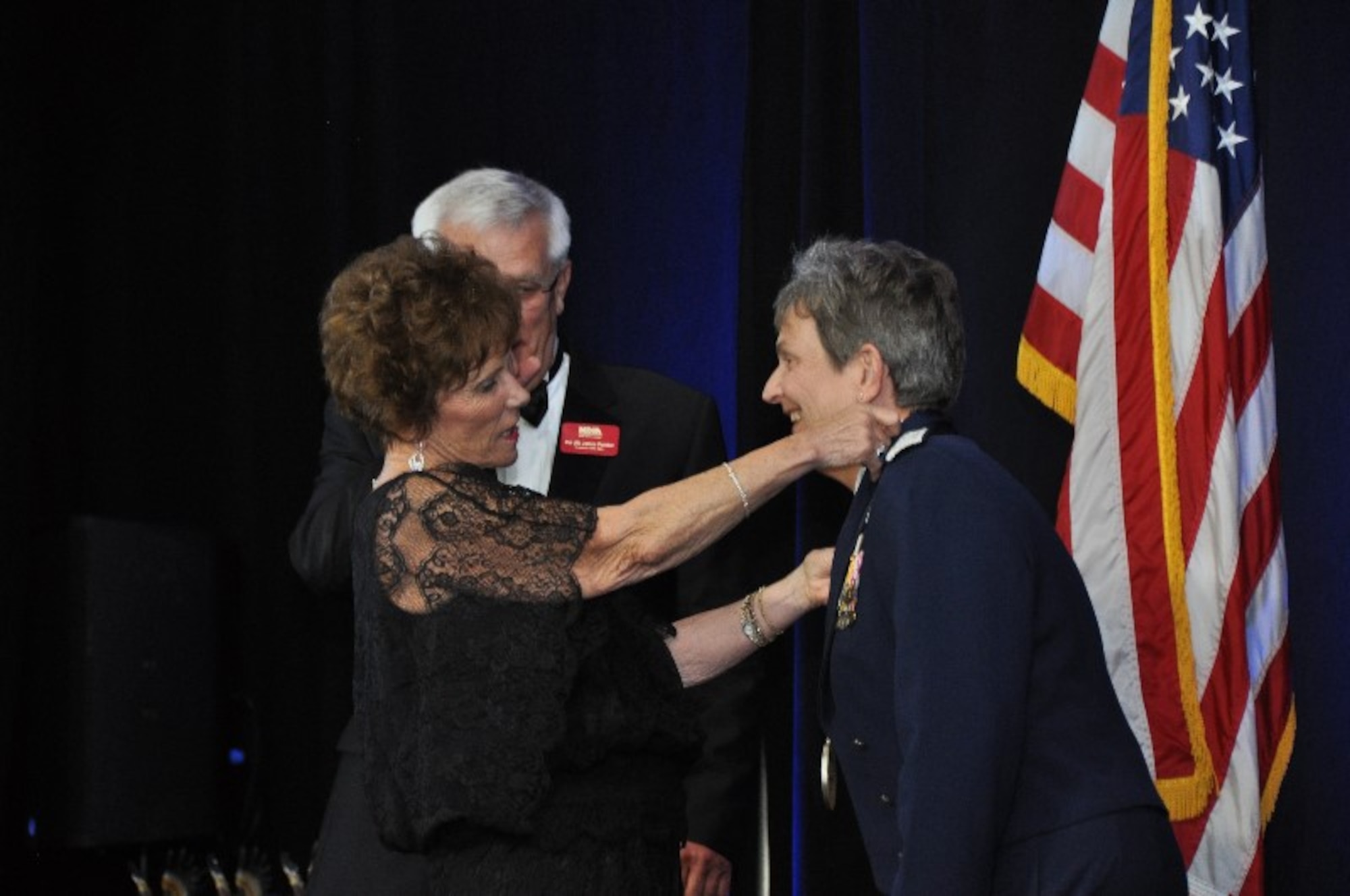 General Ellen Pawlikowski, Commander, Air Force Materiel Command, receives the General James V. Hartinger Award from Mrs. Mickie Hartinger at the National Defense Industrial Association, Rocky Mountain Ball here Sep. 9.  The Hartinger Award, named for the first commander of Air Force Space Command, is given annually by the Rocky Mountain NDIA chapter to recognize individuals for their outstanding achievement in the military space mission of the United States.  Previous Hartinger Award winners also attended the event, including retired General "Chuck" Horner, who directed the air campaign during Operation Desert Storm.