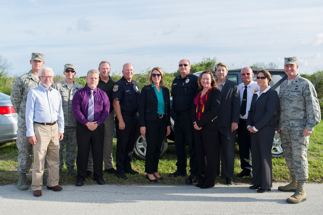 The Secretary of the Air Force Deborah Lee James, poses Sept. 9, 2016, with members of the 45th Space Wing Incident Management Team, who responded to the Falcon 9 Static Test Fire anomaly on Space Launch Complex 40 at Cape Canaveral Air Force Station, Fla. James met with the team and personally thanked them for managing the response to the anomaly. (U.S. Air Force photo/Matthew Jurgens) 