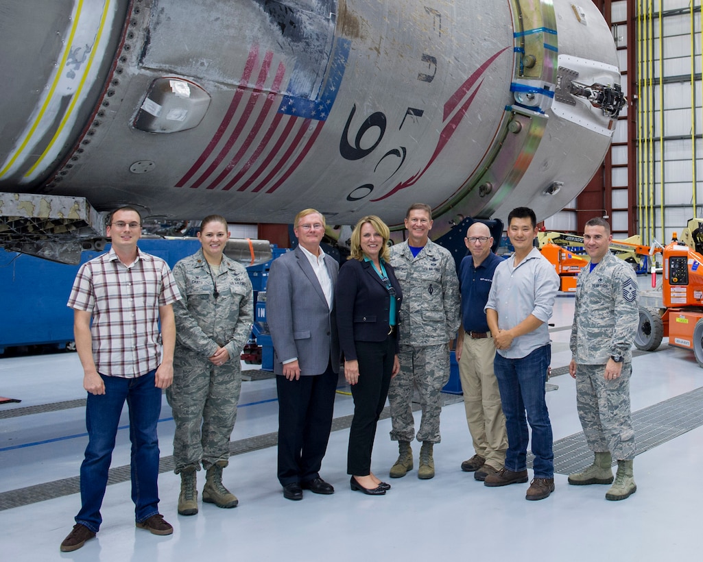The Secretary of the Air Force Deborah Lee James, poses in front of a Falcon 9 booster with members of the 45th Space Wing and SpaceX during a tour to Kennedy Space Center’s Space Launch Complex 39A Sept. 9, 2016, at Cape Canaveral, Fla.  Her two-day stay included an all call, meeting with members of Patrick-Cape and its mission partners, and a visit to the Atlas Spacecraft Operations Center where she witnessed her first launch at the Eastern Range. (U.S. Air Force photo/Matthew Jurgens)