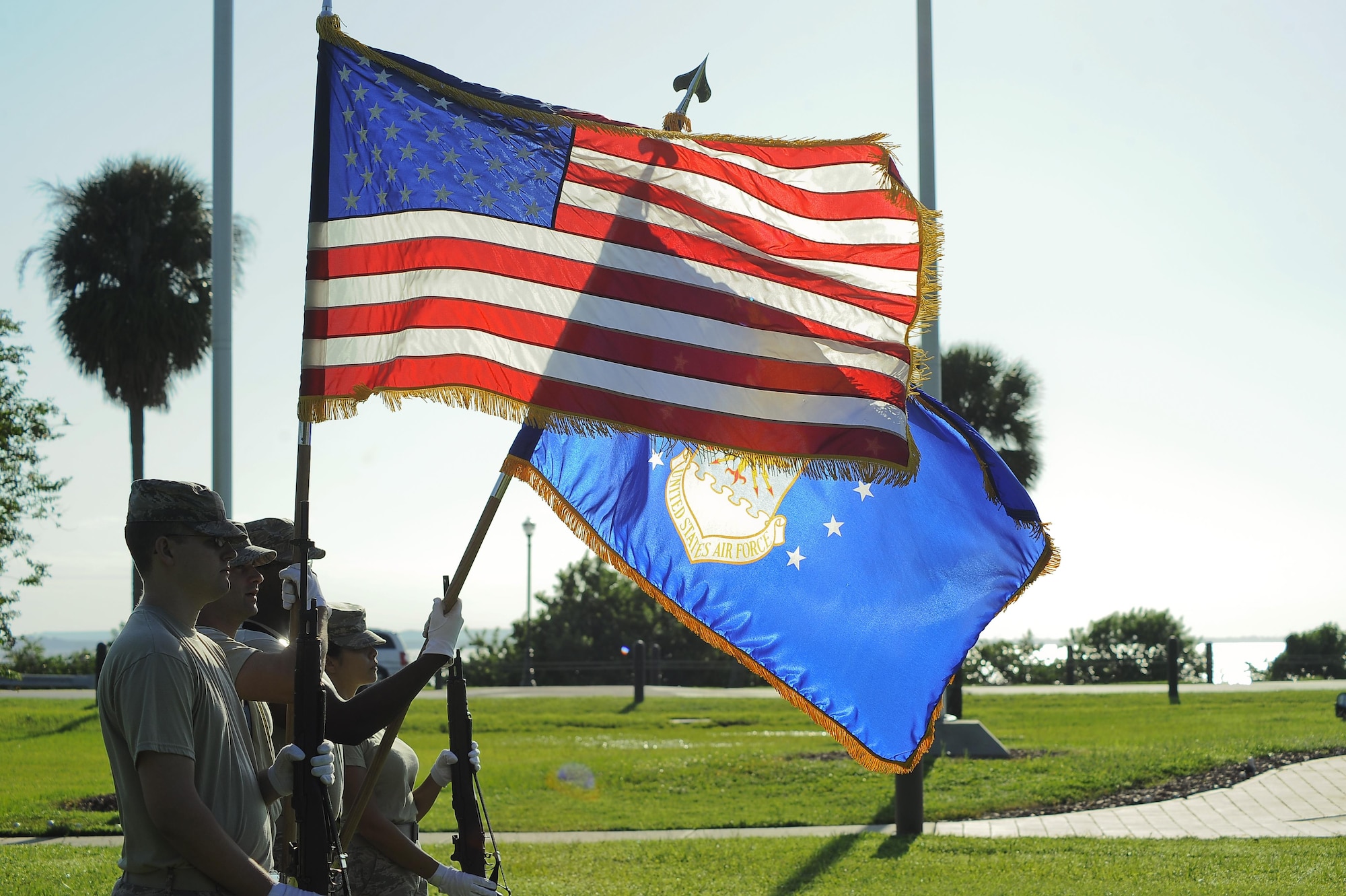 Col. April Vogel, left, the commander of the 6th Air Mobility Wing, is presented a flag from Tech. Sgt. Bajame Kirby, the NCO in charge of the MacDill Base Honor Guard assigned to the 6th Force Support Squadron, during an active-duty full-honors funeral demonstration at MacDill Air Force Base, Fla., Sept. 6, 2016. During a military funeral, the next of kin is presented the folded American flag. (U.S. Air Force photo by Airman 1st Class Mariette Adams)