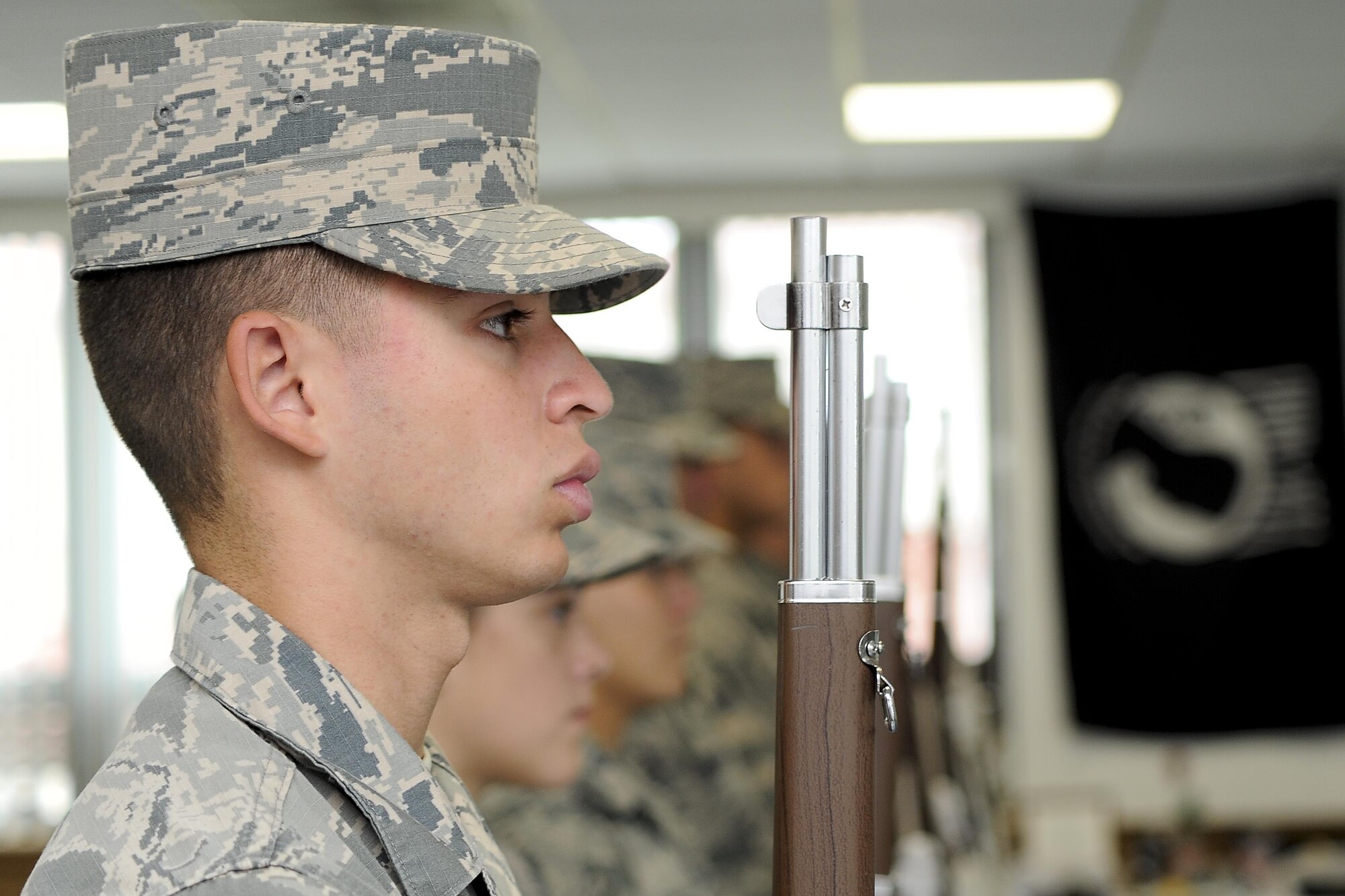 Col. April Vogel, left, the commander of the 6th Air Mobility Wing, is presented a flag from Tech. Sgt. Bajame Kirby, the NCO in charge of the MacDill Base Honor Guard assigned to the 6th Force Support Squadron, during an active-duty full-honors funeral demonstration at MacDill Air Force Base, Fla., Sept. 6, 2016. During a military funeral, the next of kin is presented the folded American flag. (U.S. Air Force photo by Airman 1st Class Mariette Adams)