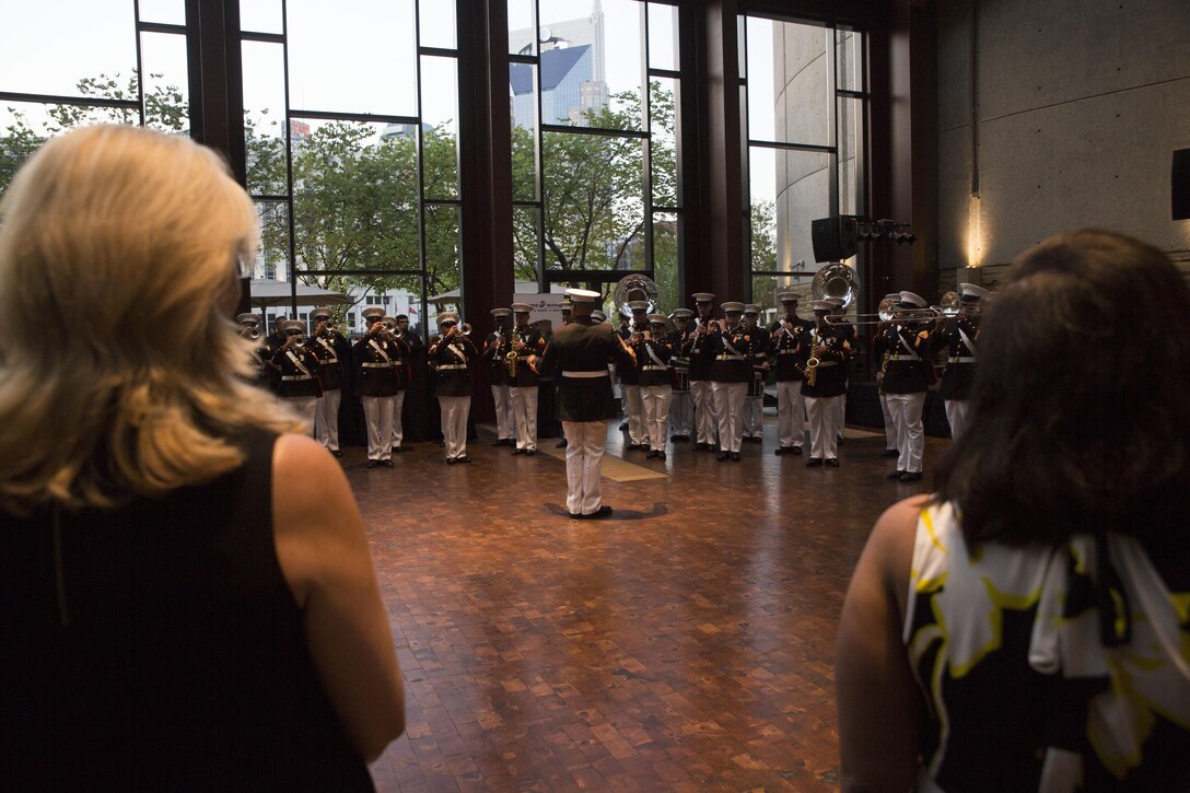 The San Diego Marine Band performs during the Community Leaders Reception at the Country Music Hall of Fame and Museum in Nashville, Tenn., Sept. 6, 2016. The reception is held to increase access to diverse community leaders, support Recruiting Station Nashville's recruiting mission and generate excitement for Marine Week, preceding the start of the event Sept. 7, 2016. Marine Week, an annual event held in a different city each year, is a celebration of Community, Country and Corps that allows the public to learn about the Corps through hands-on static displays, live demonstrations, time-honored Marine Corps traditions, musical performances and more. Barry is the 7th mayor of the Metropolitan Government of Nashville and Davidson County. Bailey is the Deputy Commandant for Plans, Policies and Operations.