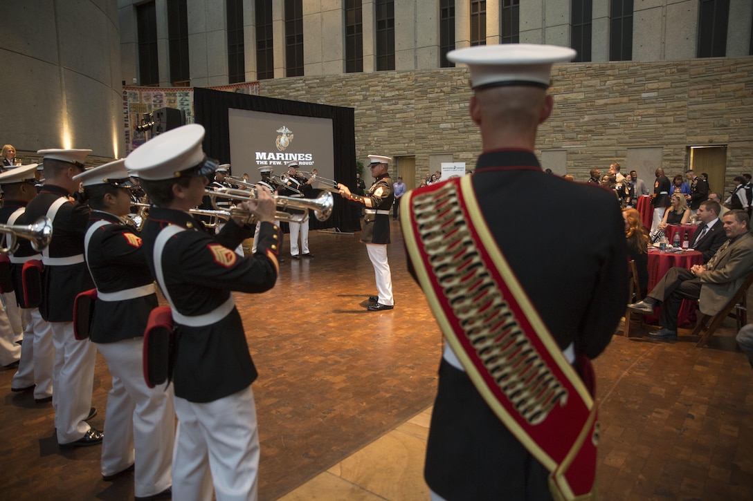 The San Diego Marine Band performs during the Community Leaders Reception at the Country Music Hall of Fame and Museum in Nashville, Tenn., Sept. 6, 2016. The reception is held to increase access to diverse community leaders, support Recruiting Station Nashville's recruiting mission and generate excitement for Marine Week, preceding the start of the event Sept. 7, 2016. Marine Week, an annual event held in a different city each year, is a celebration of Community, Country and Corps that allows the public to learn about the Corps through hands-on static displays, live demonstrations, time-honored Marine Corps traditions, musical performances and more. Barry is the 7th mayor of the Metropolitan Government of Nashville and Davidson County. Bailey is the Deputy Commandant for Plans, Policies and Operations.