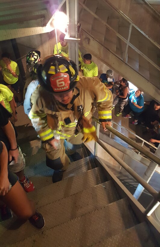 A Firefighter in full uniform and personal protection equipment climbs 110 flights of stairs in the Tower of The Americas to pay tribute to the 343 fallen firefighters and 70 Law enforcement and 9 Emergency Medical Personnel who lost their lives at ground zero on September 11, 2001. The equipment the firefighters wear can exceed more than 75 pounds. Two ascents of the towers equaled the height of the World Trade Center Towers. (U.S. Army photo by 1SG Timothy Lawn, 205th PCH)