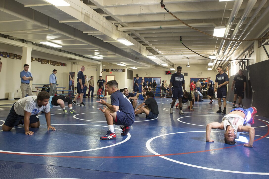 Wrestlers with the All-Marine Wrestling Team practice with the McGavock High School Wrestling Team during Marine Week Nashville, Sept. 7, 2016. After practicing with the students, the Marines answered questions about wrestling and discussed the All-Marine Sports Program and the opportunities available to athletes in the Corps. More than 700 Marines are participating in Marine Week Nashville to give members of the community the opportunity to interact with individual Marines and celebrate community, country, and Corps.