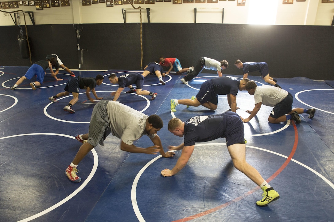 Wrestlers with the All-Marine Wrestling Team practice with the McGavock High School Wrestling Team during Marine Week Nashville, Sept. 7, 2016. After practicing with the students, the Marines answered questions about wrestling and discussed the All-Marine Sports Program and the opportunities available to athletes in the Corps. More than 700 Marines are participating in Marine Week Nashville to give members of the community the opportunity to interact with individual Marines and celebrate community, country, and Corps.
