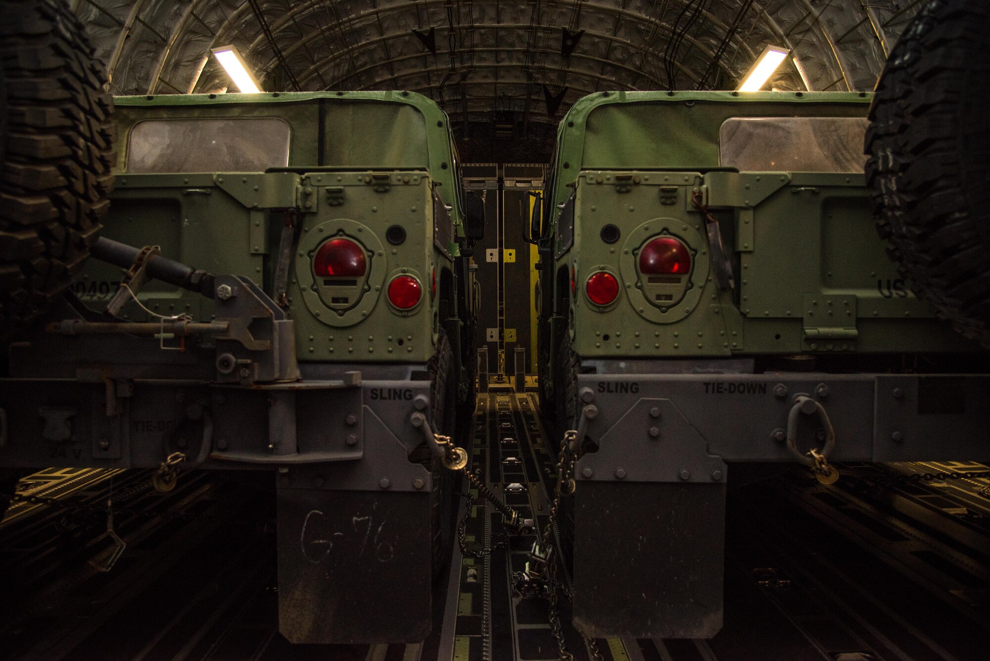 Two Army Humvees are transported to Stennis International Airport on a C-17 Globemaster III during a joint training exercise named Patriot Mustang GRIP II. The exercise was conducted with members of the Air Force Reserve's 41st Aerial Port Squadron and 315th Airlift Wing as well as Army and Navy members from along the Gulf Coast Sept. 9-10. (U.S. Air Force photo/Staff Sgt. Shelton Sherrill) 