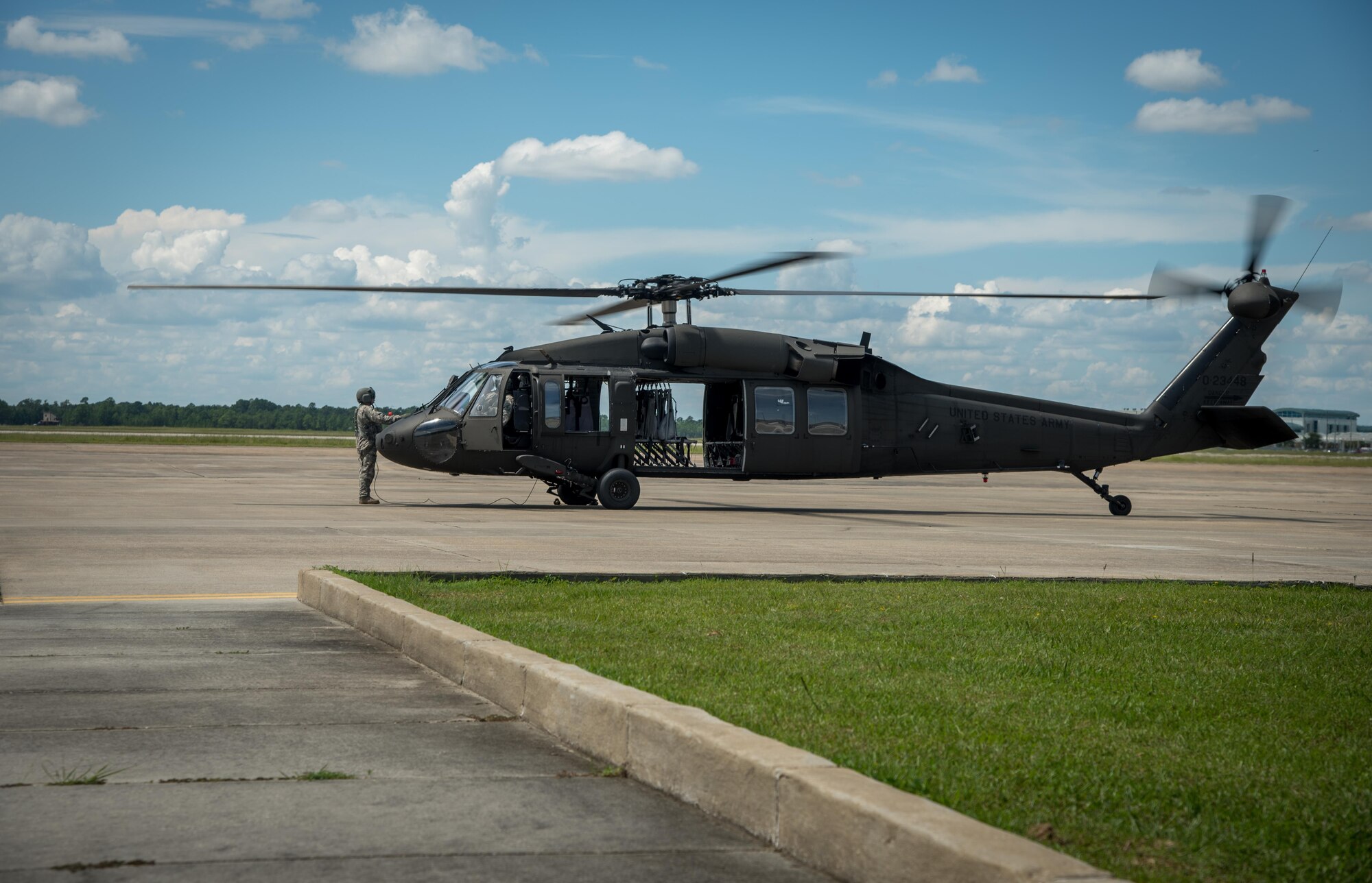 A UH-60 Blackhawk awaits liftoff during a joint training exercise named Patriot Mustang GRIP II with members of the Air Force Reserves 41st Aerial Port Squadron as well as Army and Navy members from along the Gulf Coast Sept. 9-10 at Stennis International Airport. (U.S. Air Force photo/Staff Sgt. Shelton Sherrill) 