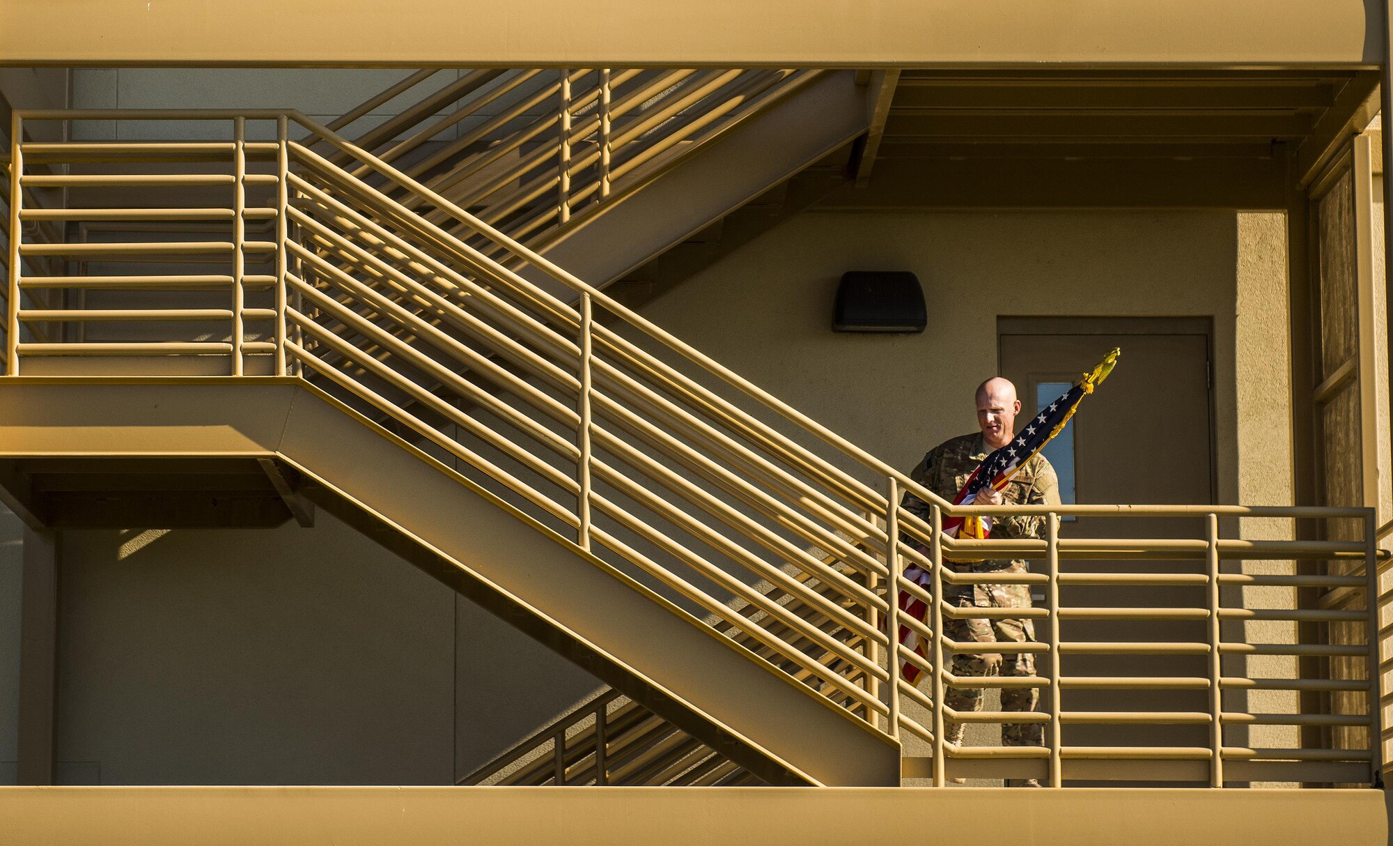 Senior Master Sgt. Michael Ross, 592nd Special Operations Maintenance Squadron, carries an American flag up a flight of stairs during a 9/11 Memorial Stair Climb event held at Duke Field, Fla., Sept. 10.  The 24-hour climb began at 8:46 a.m. with the 919th Special Operations Wing commander walking the flag up the outside stairwell of the base’s billeting facility.  Wing Airmen took turns walking the flag up and down the stairwell the entire day until it was delivered to a firefighter and security forces color guard at 8:46 a.m. the next morning for a 9/11 Remembrance ceremony. More than 115 Airmen carried the flag throughout the day and night for a total of more than 207,000 steps. (U.S. Air Force photo/Tech. Sgt. Sam King)