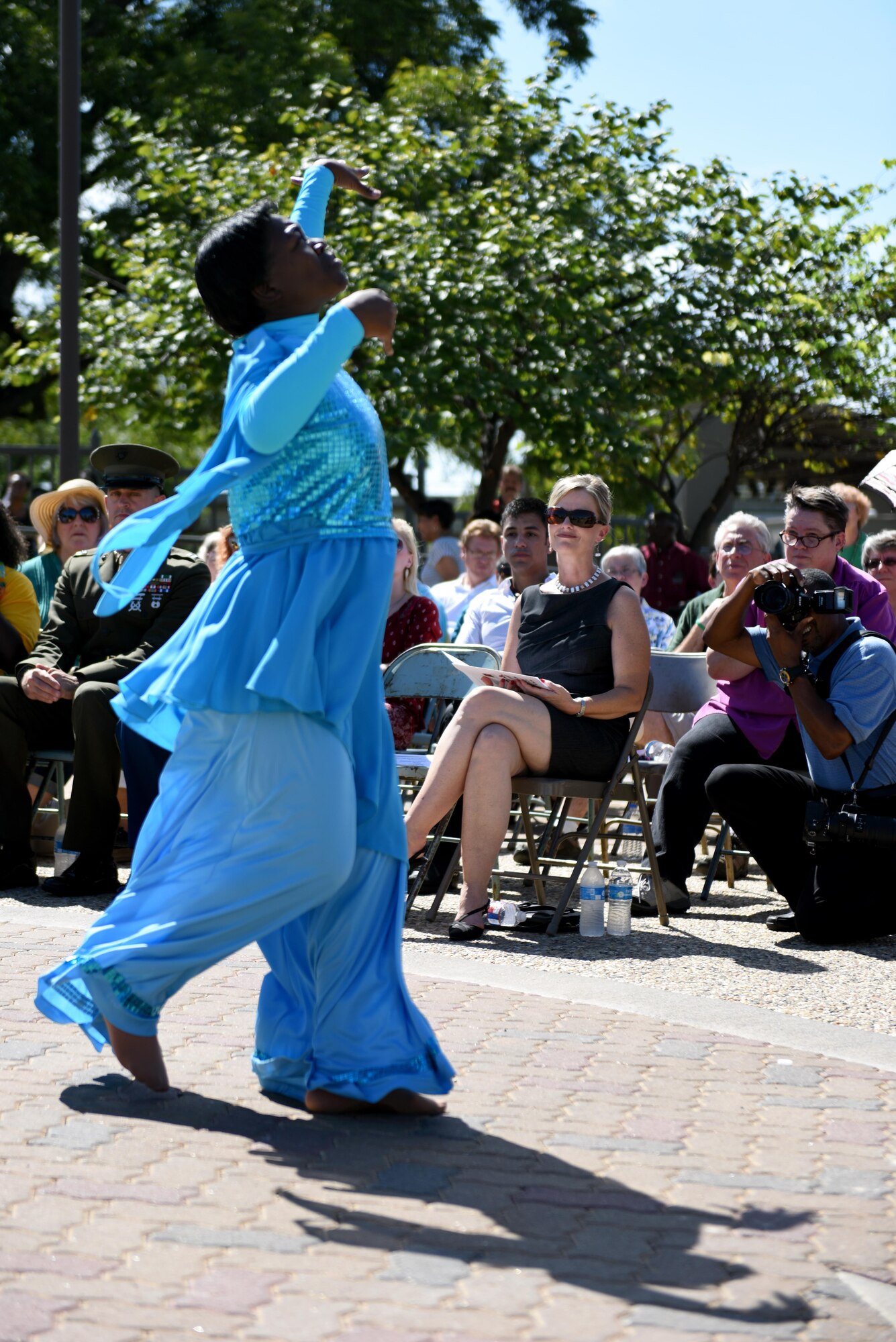 Leah Downs, Goodfellow Air Force Base key spouse, watches Tamara Pope dance during the San Angelo 9/11 Remembrance Ceremony at the Fine Arts Museum in San Angelo, Texas, Sept. 11, 2016. Pope danced to ‘Peace in the Valley’ to represent Generation X’s presentation of peace to the victims of the attacks of 9/11. (U.S. Air Force photo by Airman 1st Class Caelynn Ferguson/Released)